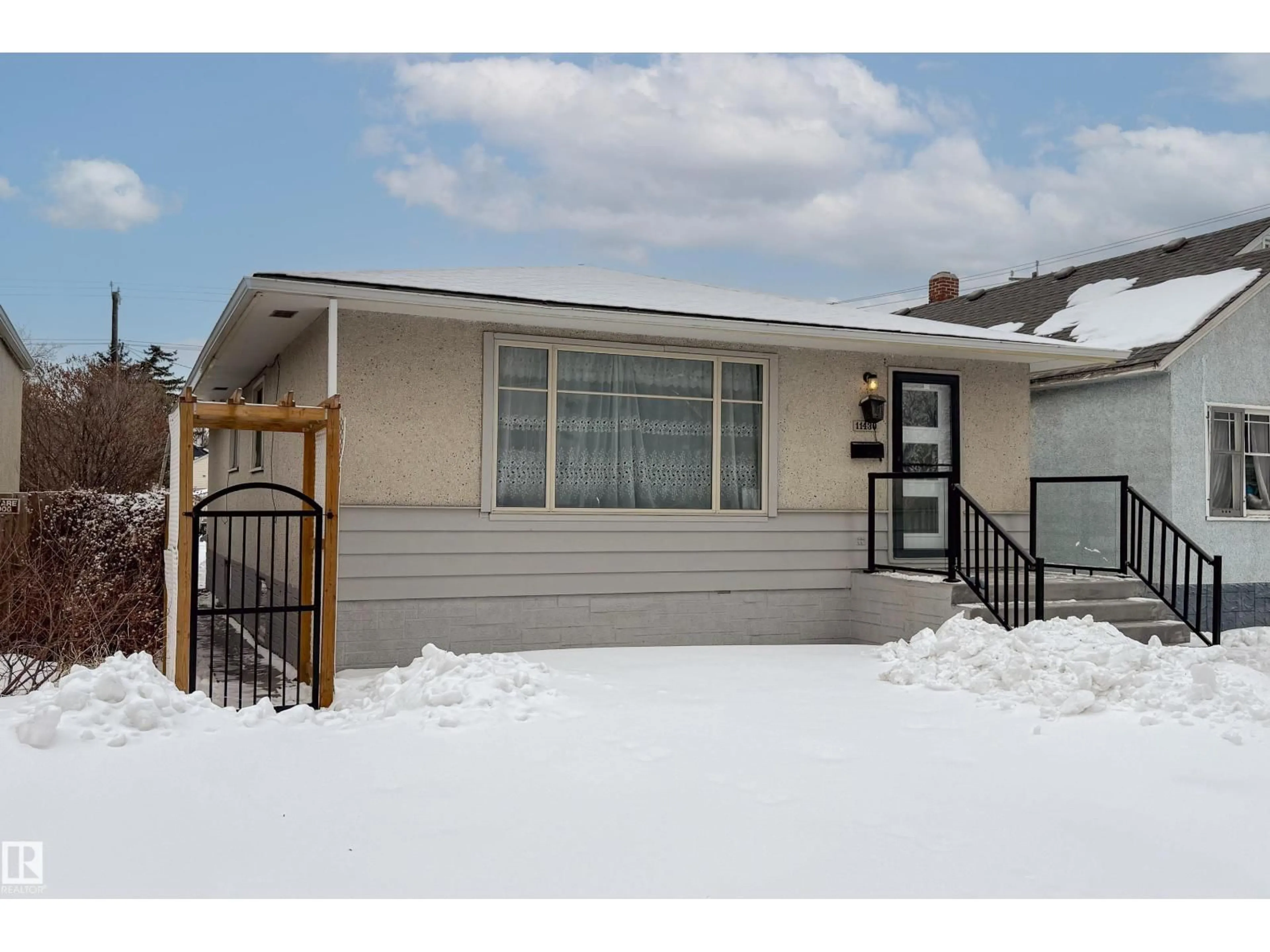 Home with vinyl exterior material, street for NW - 11430 81 ST, Edmonton Alberta T5B2R6