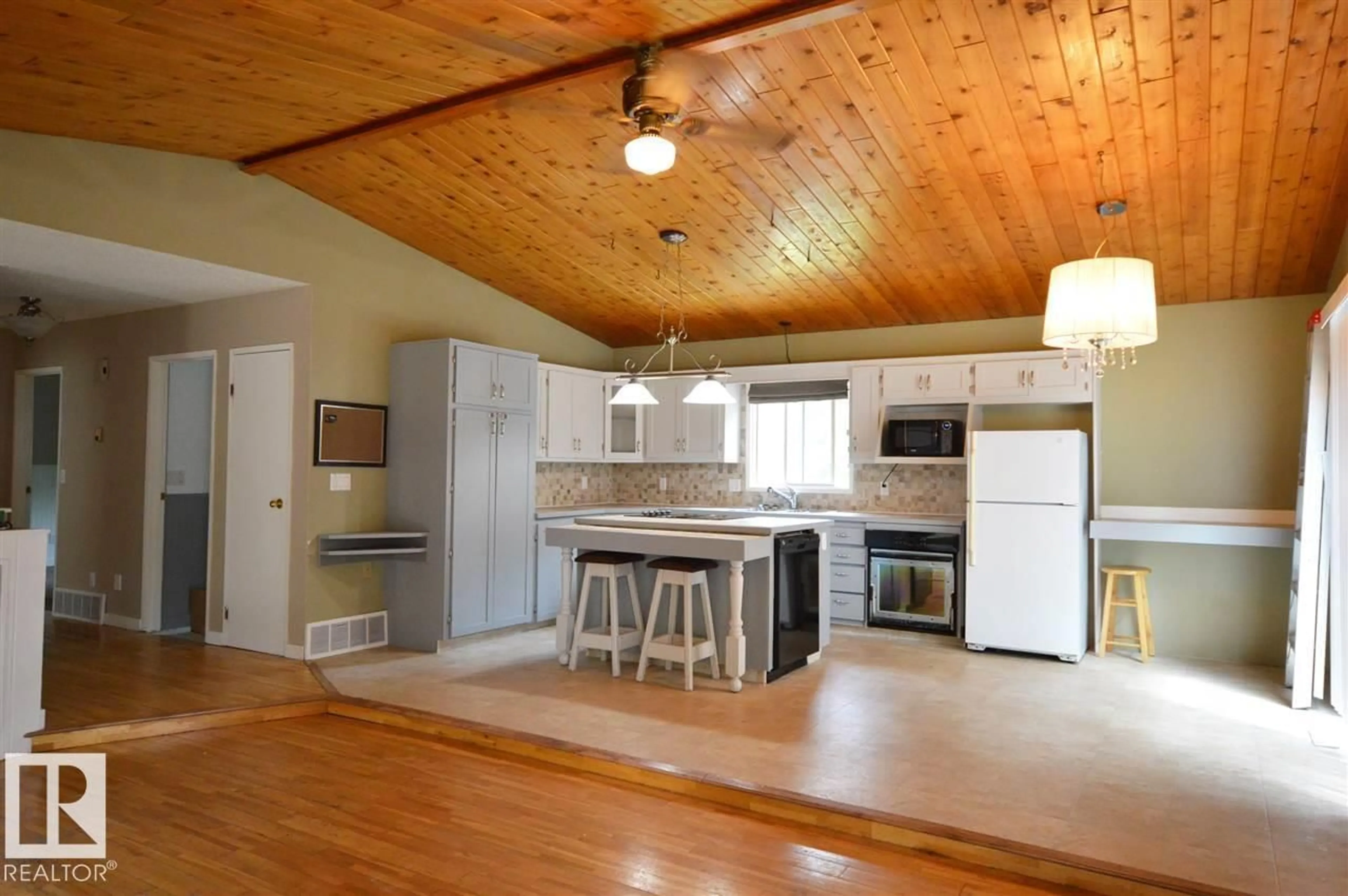 Open concept kitchen, wood/laminate floor for 437 61209 RGE RD 465, Rural Bonnyville M.D. Alberta T9N2J6