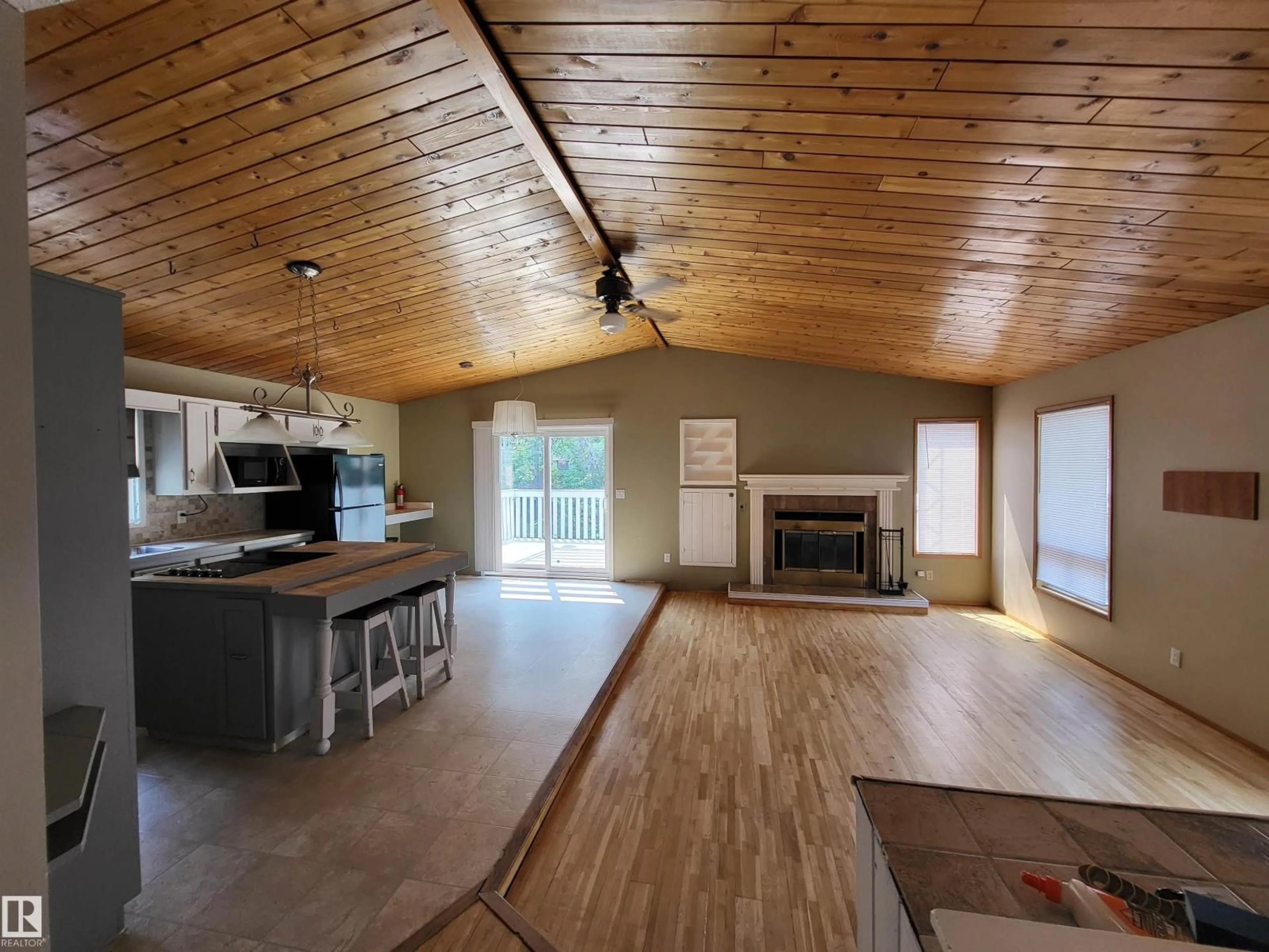 Open concept kitchen, wood/laminate floor for 437 61209 RGE RD 465, Rural Bonnyville M.D. Alberta T9N2J6