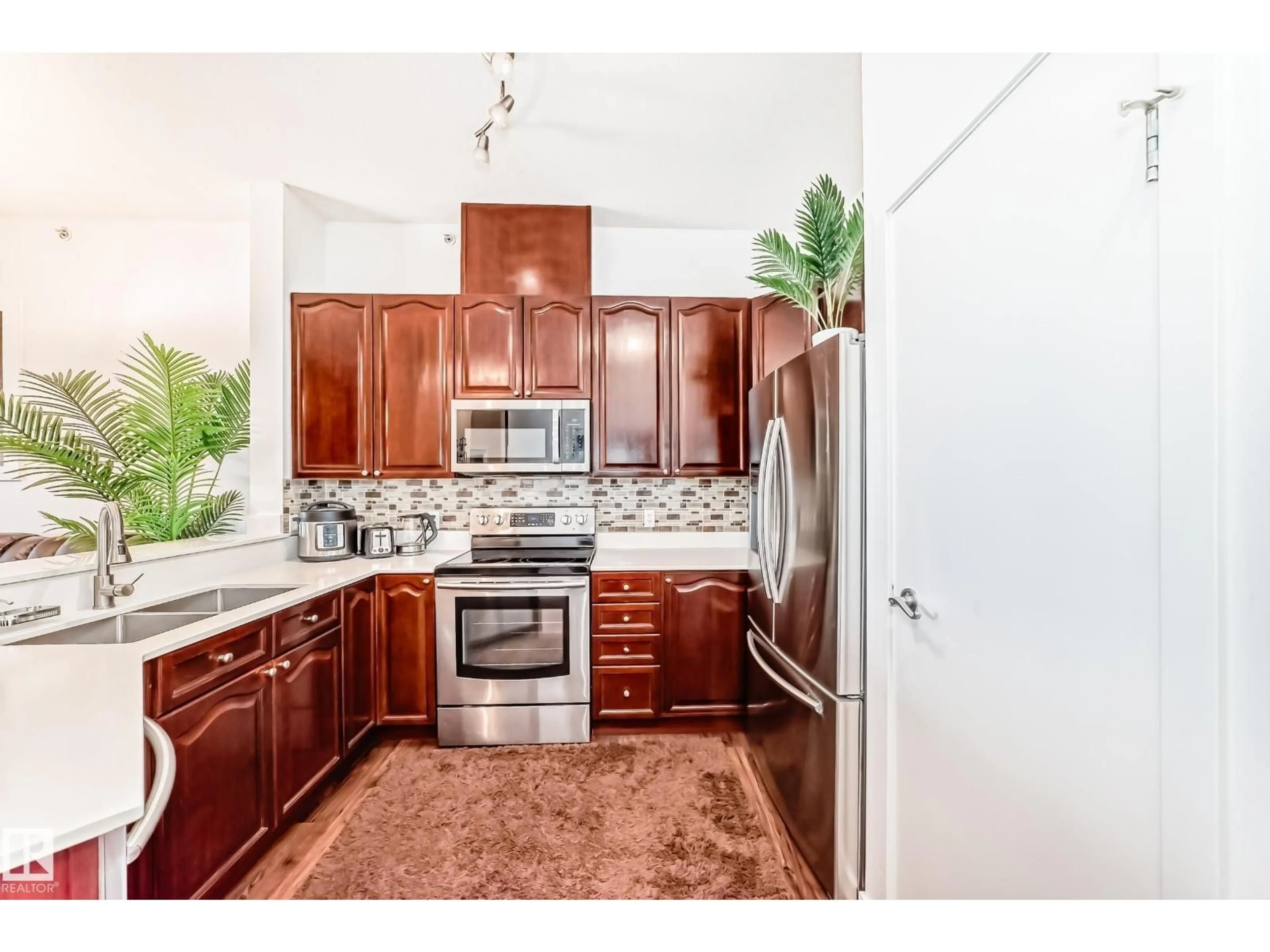 Open concept kitchen, ceramic/tile floor for #412 - 4312 139 AV, Edmonton Alberta T5Y3J4