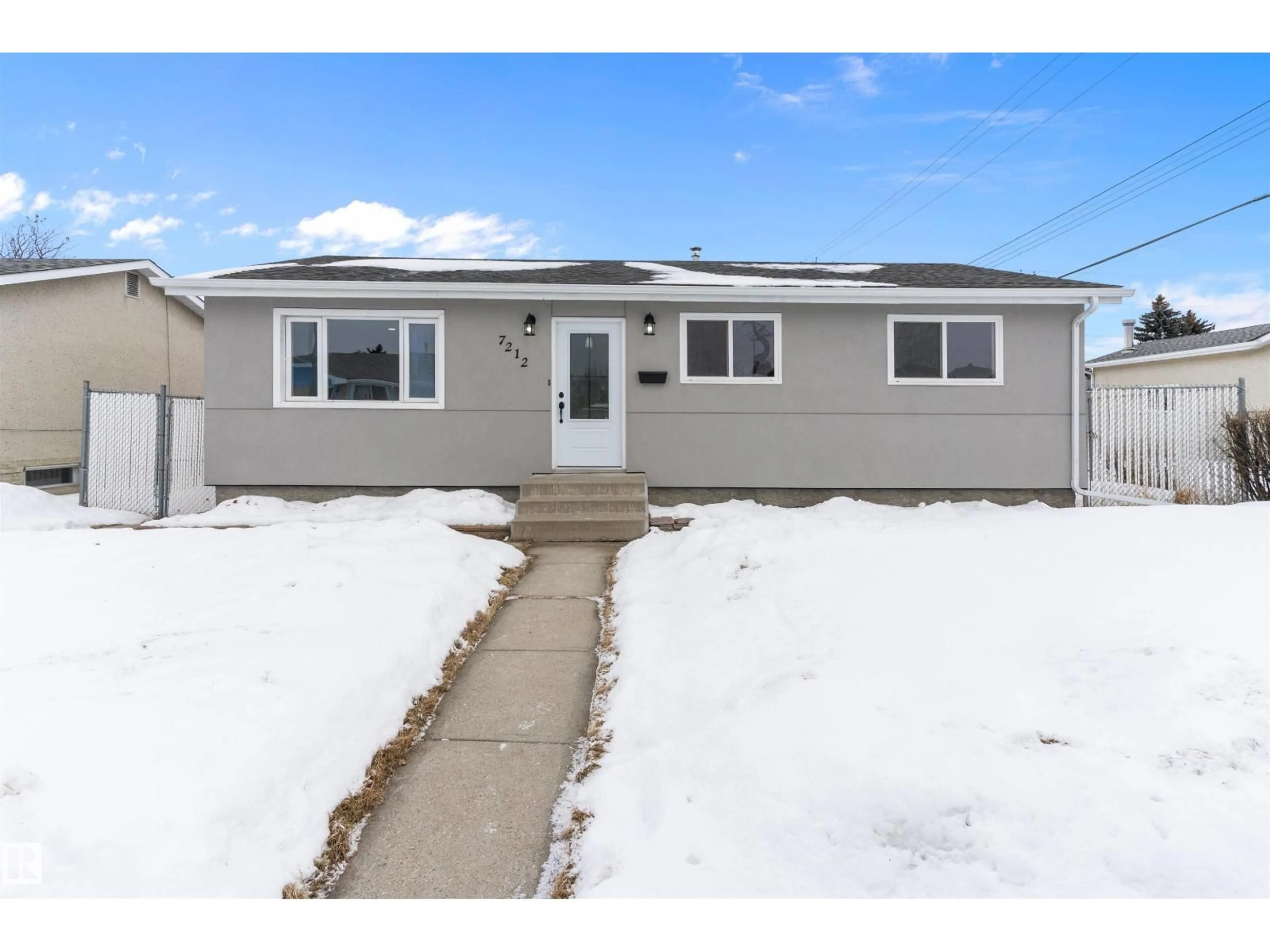 Home with vinyl exterior material, street for NW - 7212 136 AV, Edmonton Alberta T5C2K2