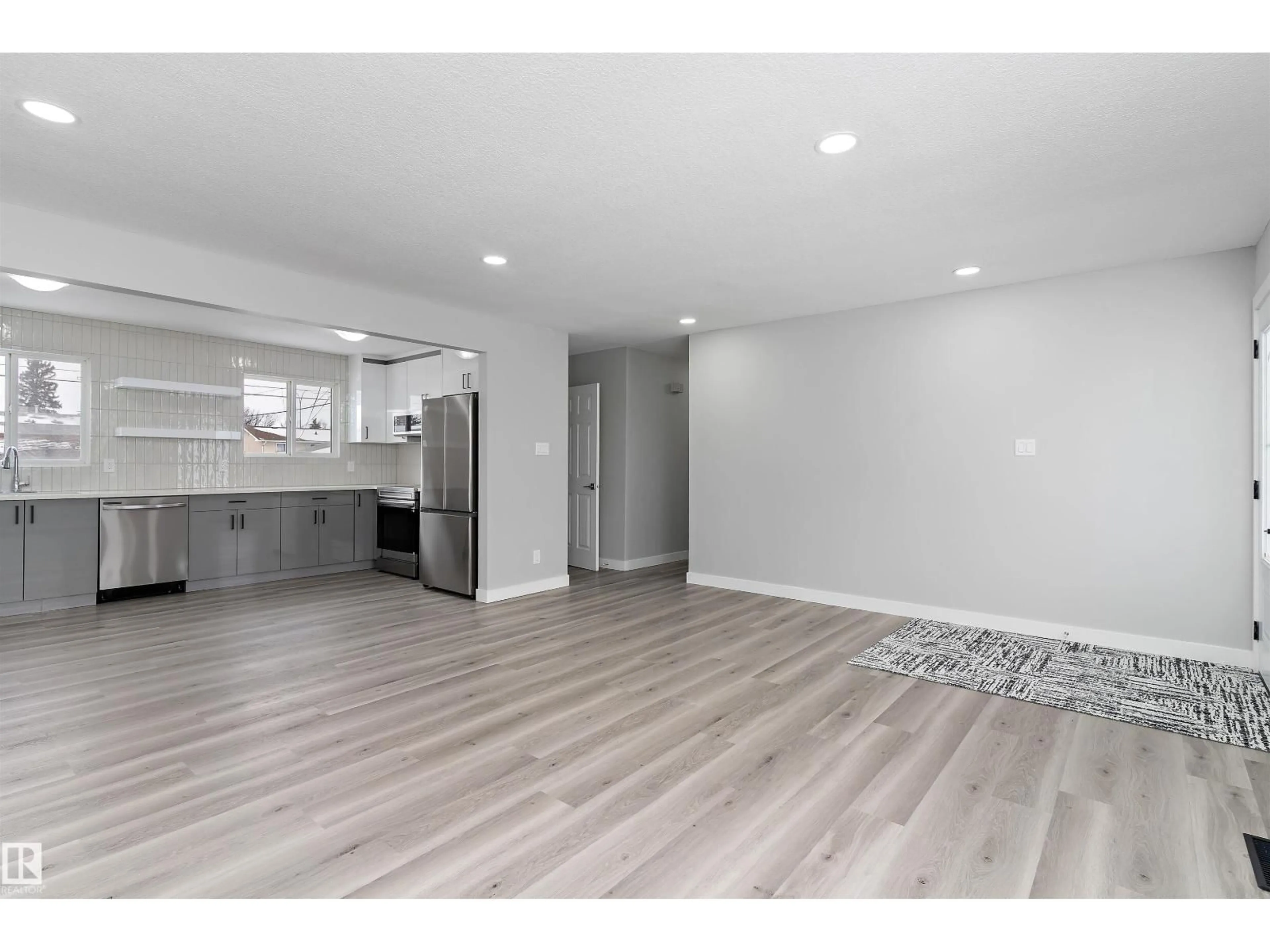 Open concept kitchen, wood/laminate floor for NW - 7212 136 AV, Edmonton Alberta T5C2K2