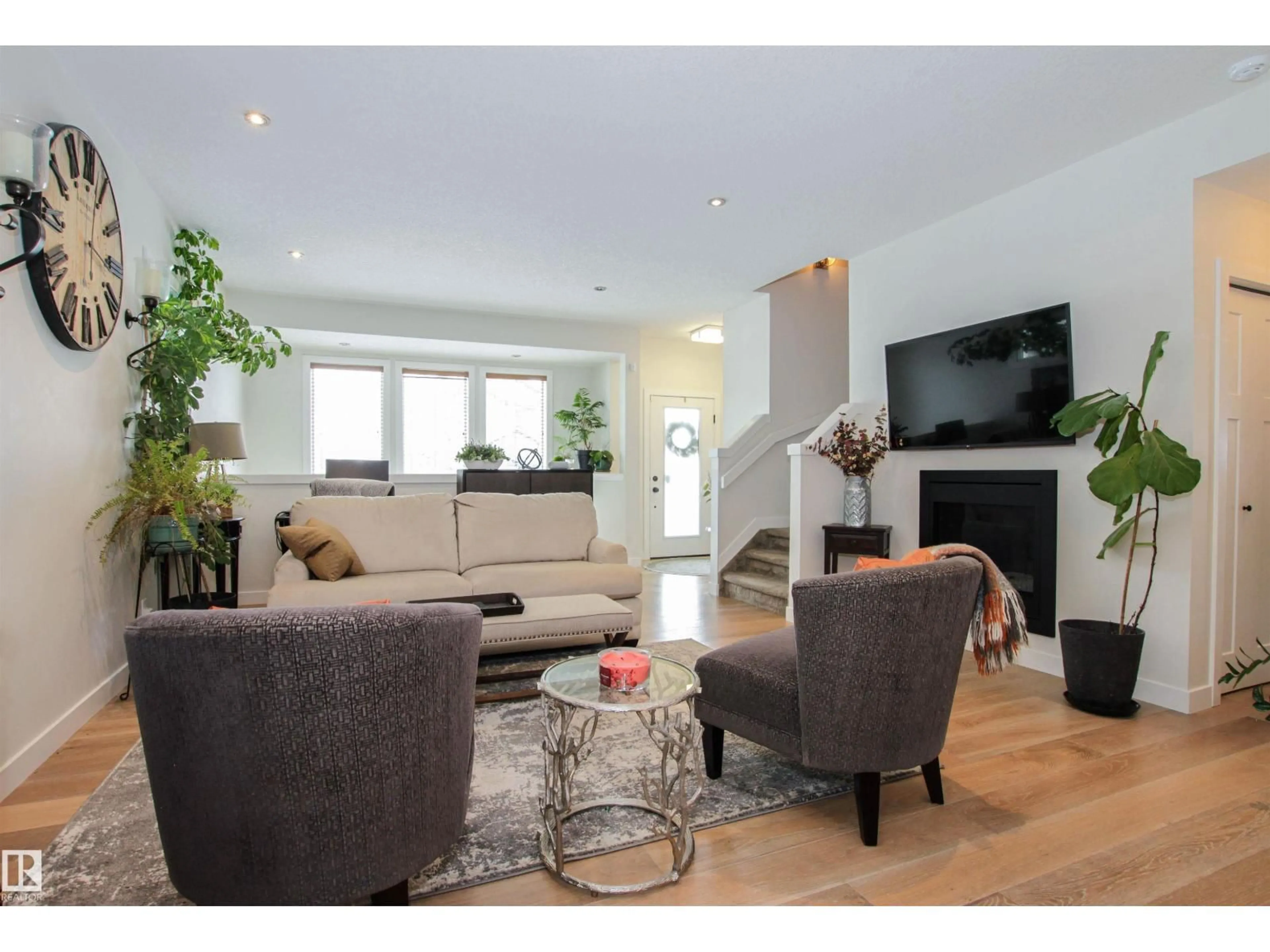 Living room with furniture, wood/laminate floor for 7200 CARDINAL WY, Edmonton Alberta T6W2Y5