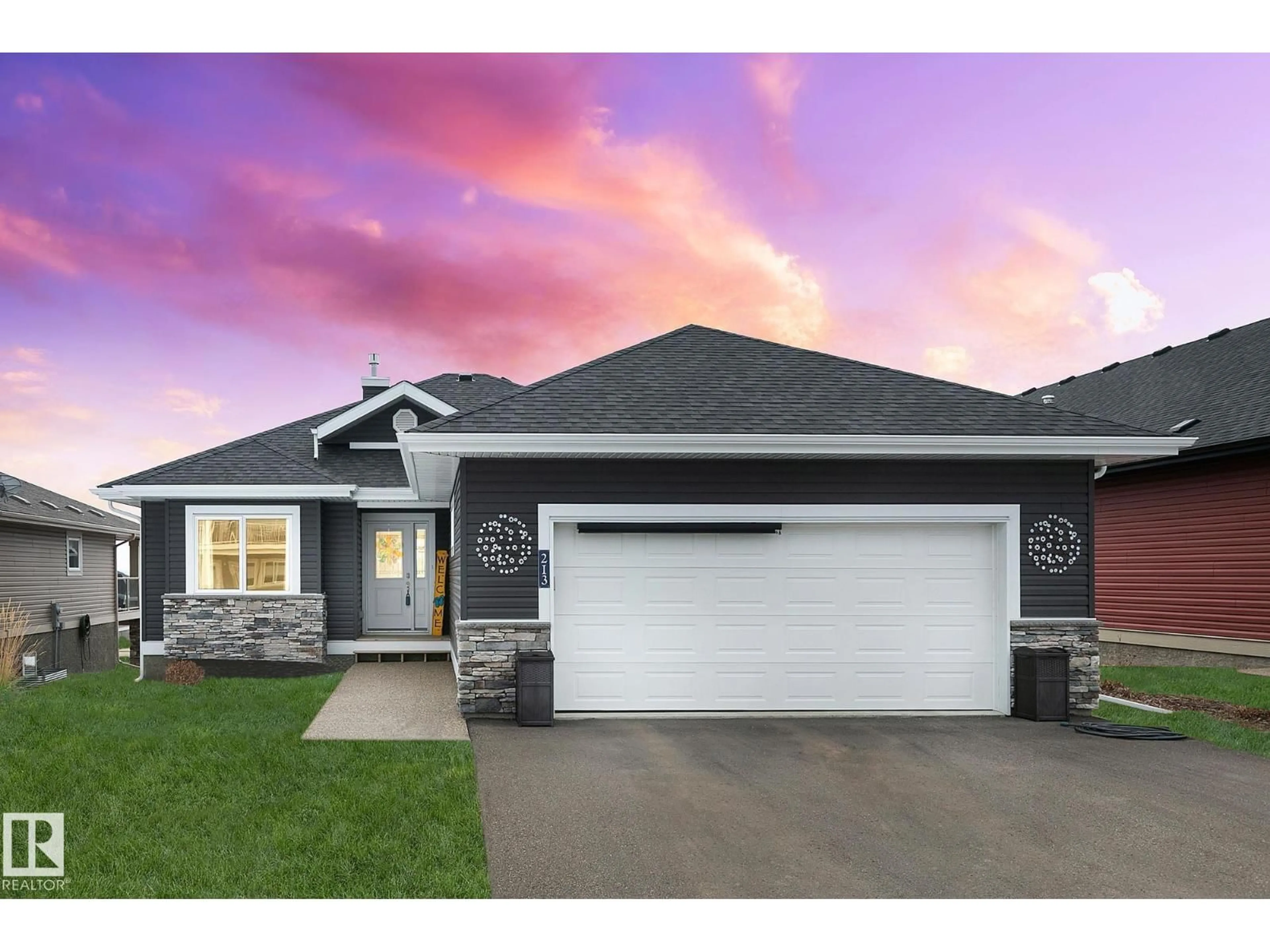 Home with brick exterior material, street for 55101 STE. ANNE TR, Rural Lac Ste. Anne County Alberta T0E0L0