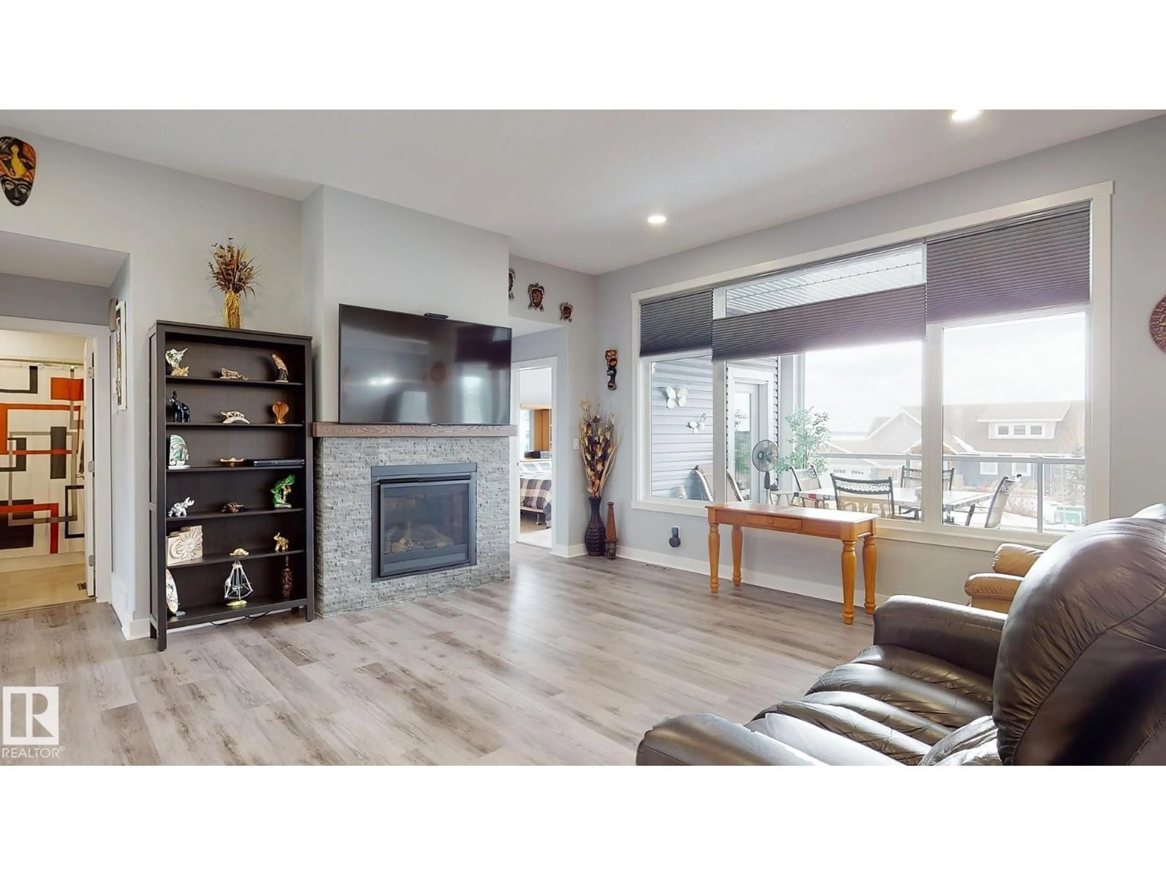 Living room with furniture, wood/laminate floor for 55101 STE. ANNE TR, Rural Lac Ste. Anne County Alberta T0E0L0