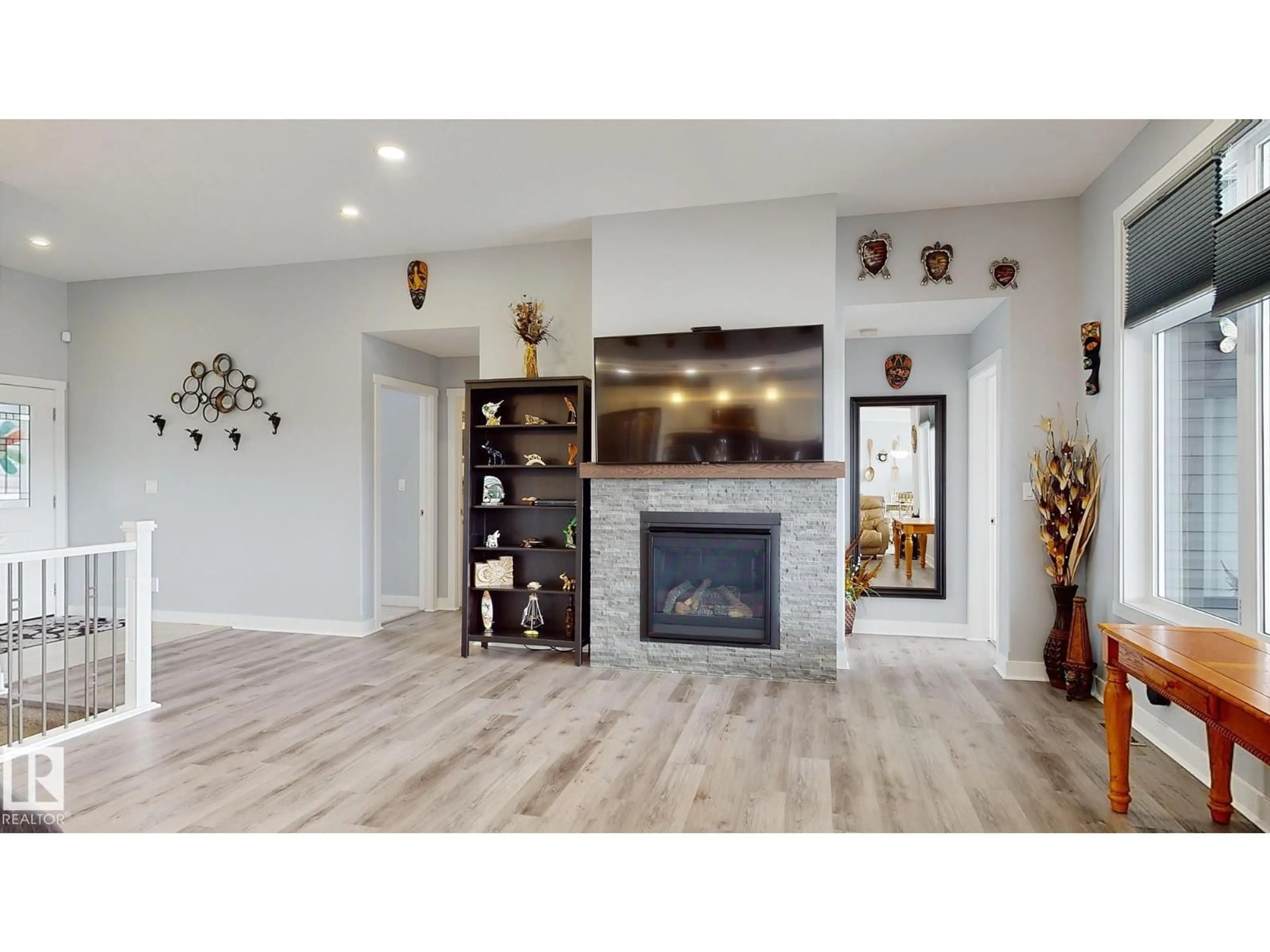 Living room with furniture, wood/laminate floor for 55101 STE. ANNE TR, Rural Lac Ste. Anne County Alberta T0E0L0