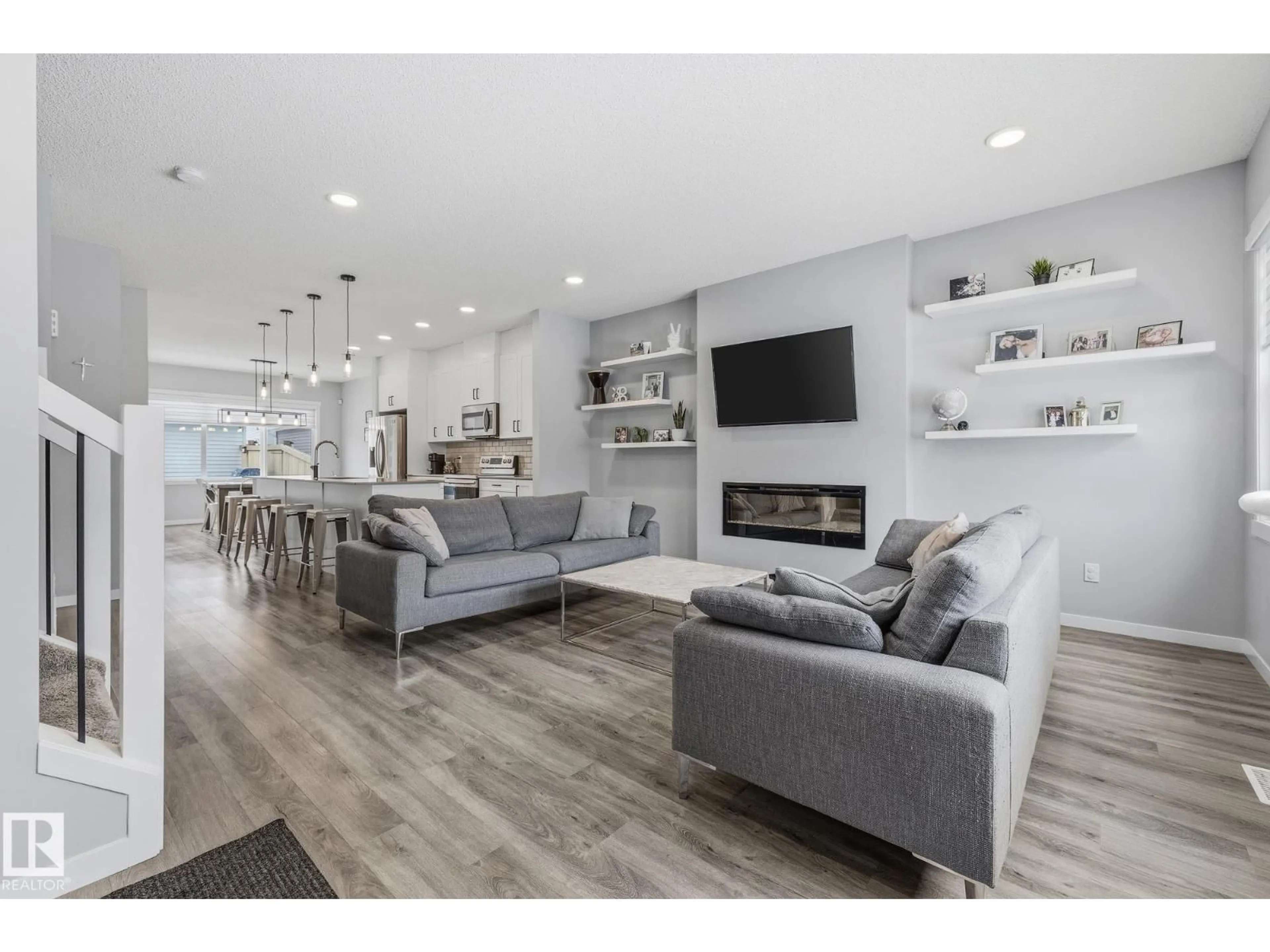 Living room with furniture, wood/laminate floor for NW - 17475 77 ST, Edmonton Alberta T5Z0R4