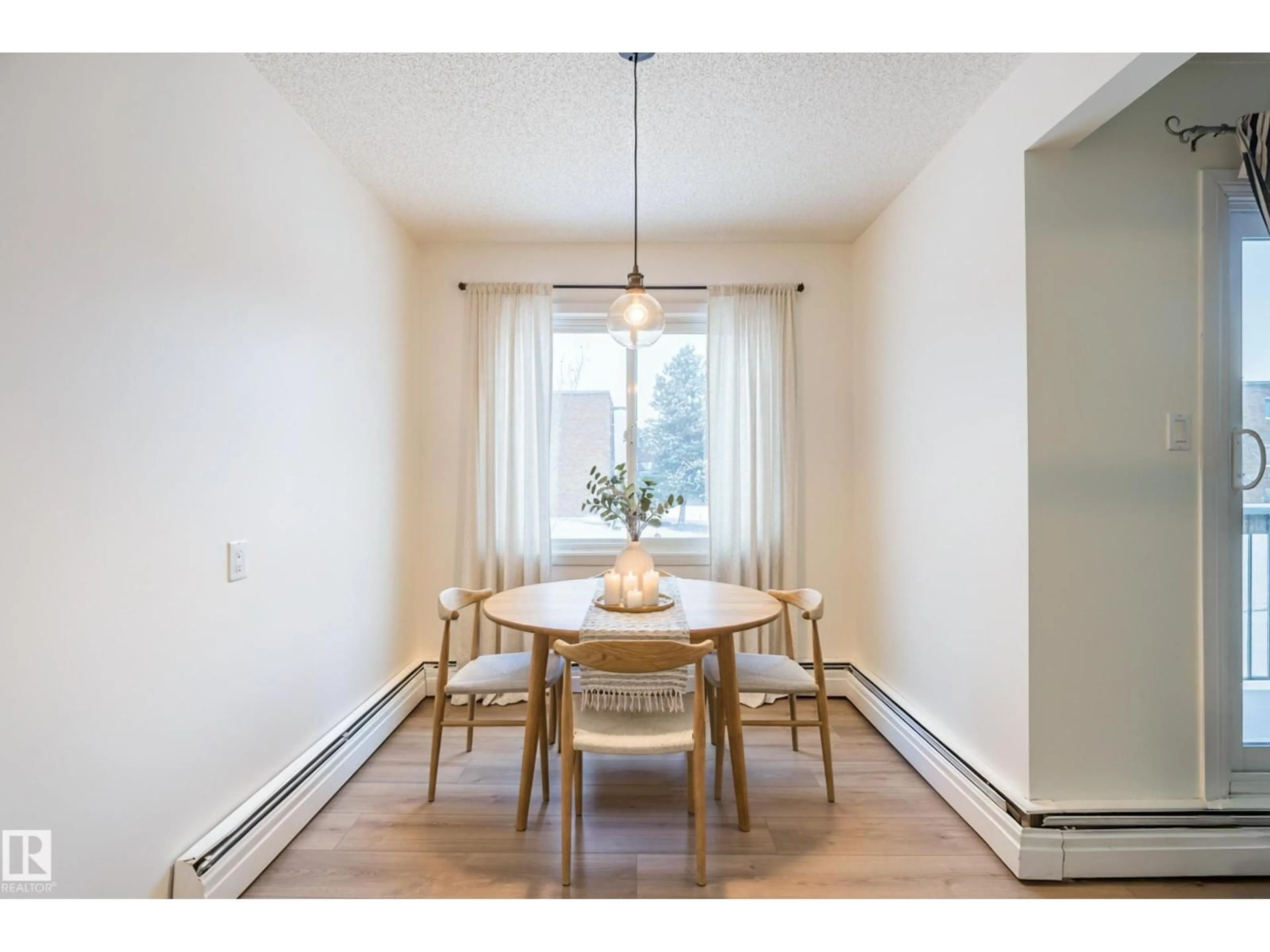Dining room, wood/laminate floor for 202 - 11450 40 AV NW, Edmonton Alberta T6J0R5