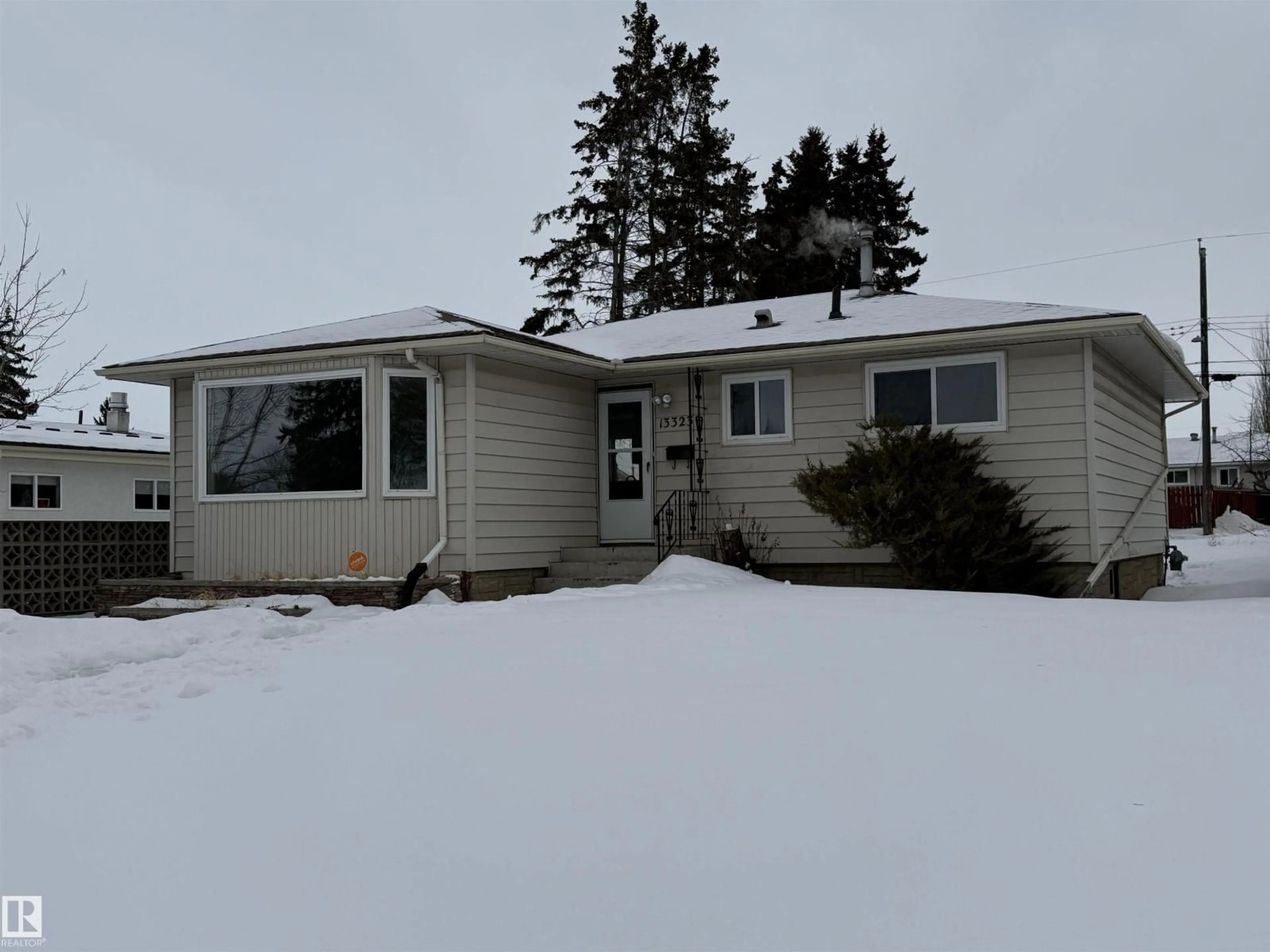 Home with vinyl exterior material, street for NW - 13323 68 ST, Edmonton Alberta T5C0G1