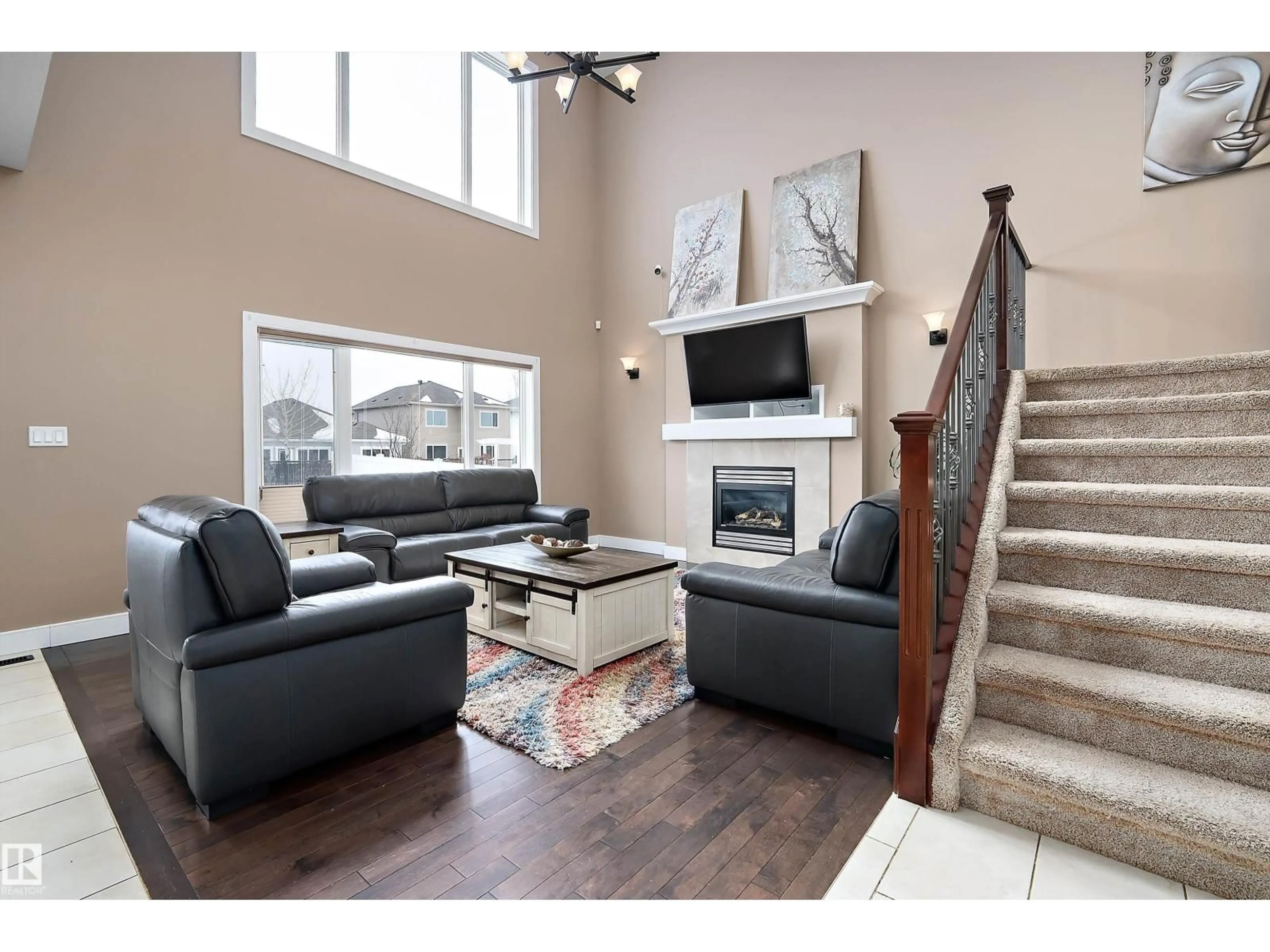 Living room with furniture, wood/laminate floor for 178 WOODHILL, Fort Saskatchewan Alberta T8L0L5