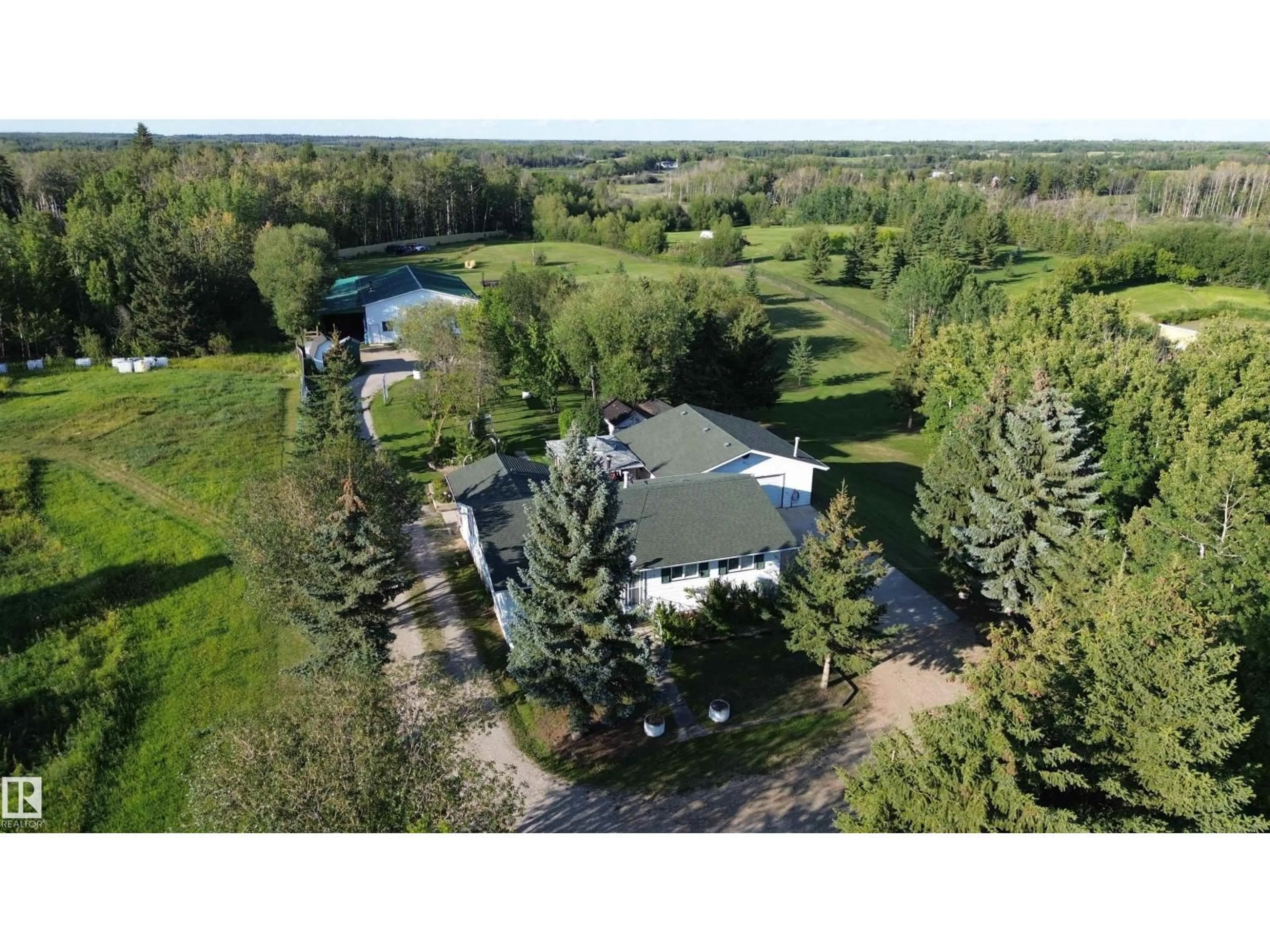 A pic from outside/outdoor area/front of a property/back of a property/a pic from drone, unknown for 14 - 53348 RGE ROAD 211, Rural Strathcona County Alberta T0B0E0