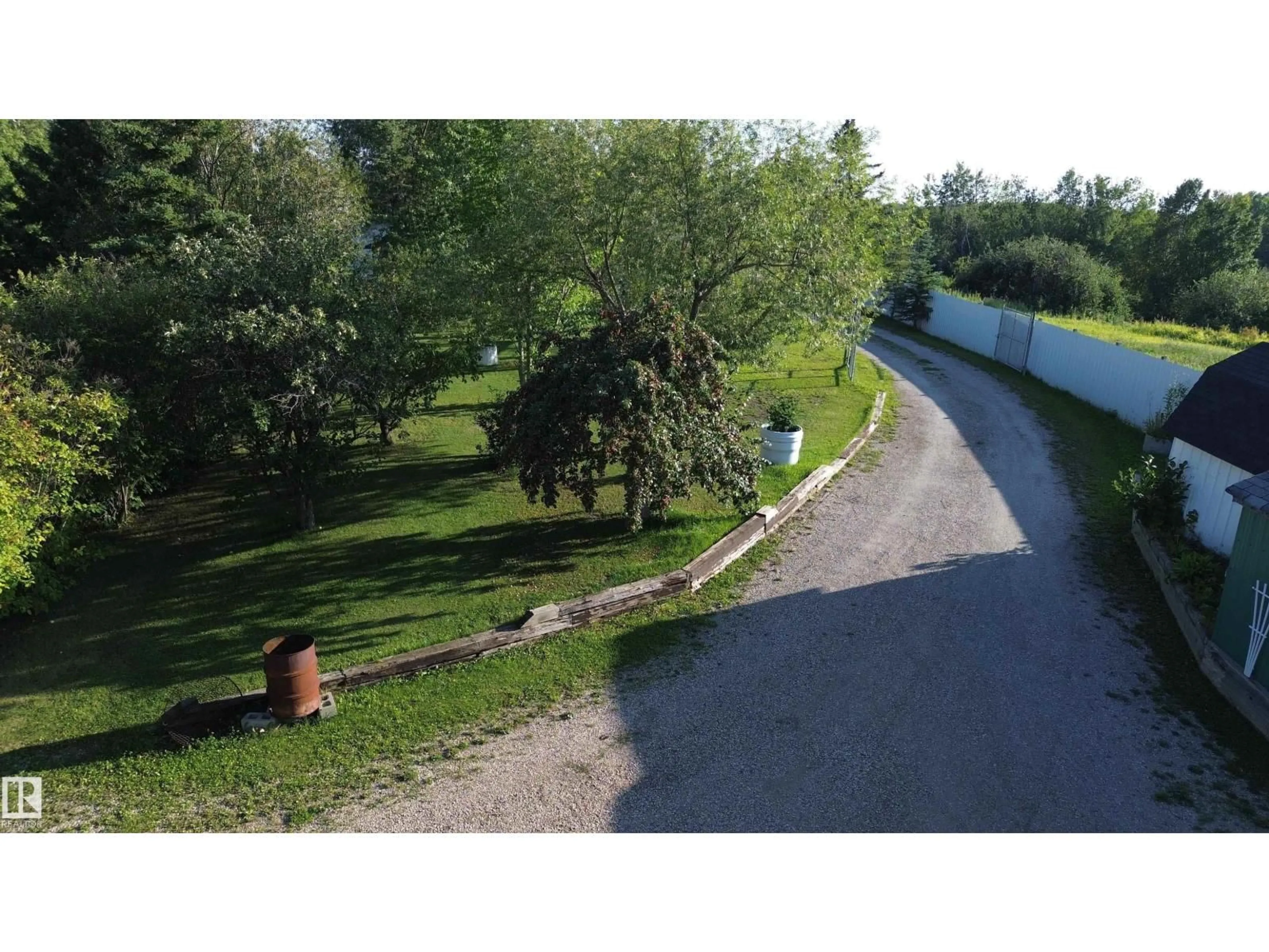 A pic from outside/outdoor area/front of a property/back of a property/a pic from drone, street for 14 - 53348 RGE ROAD 211, Rural Strathcona County Alberta T0B0E0