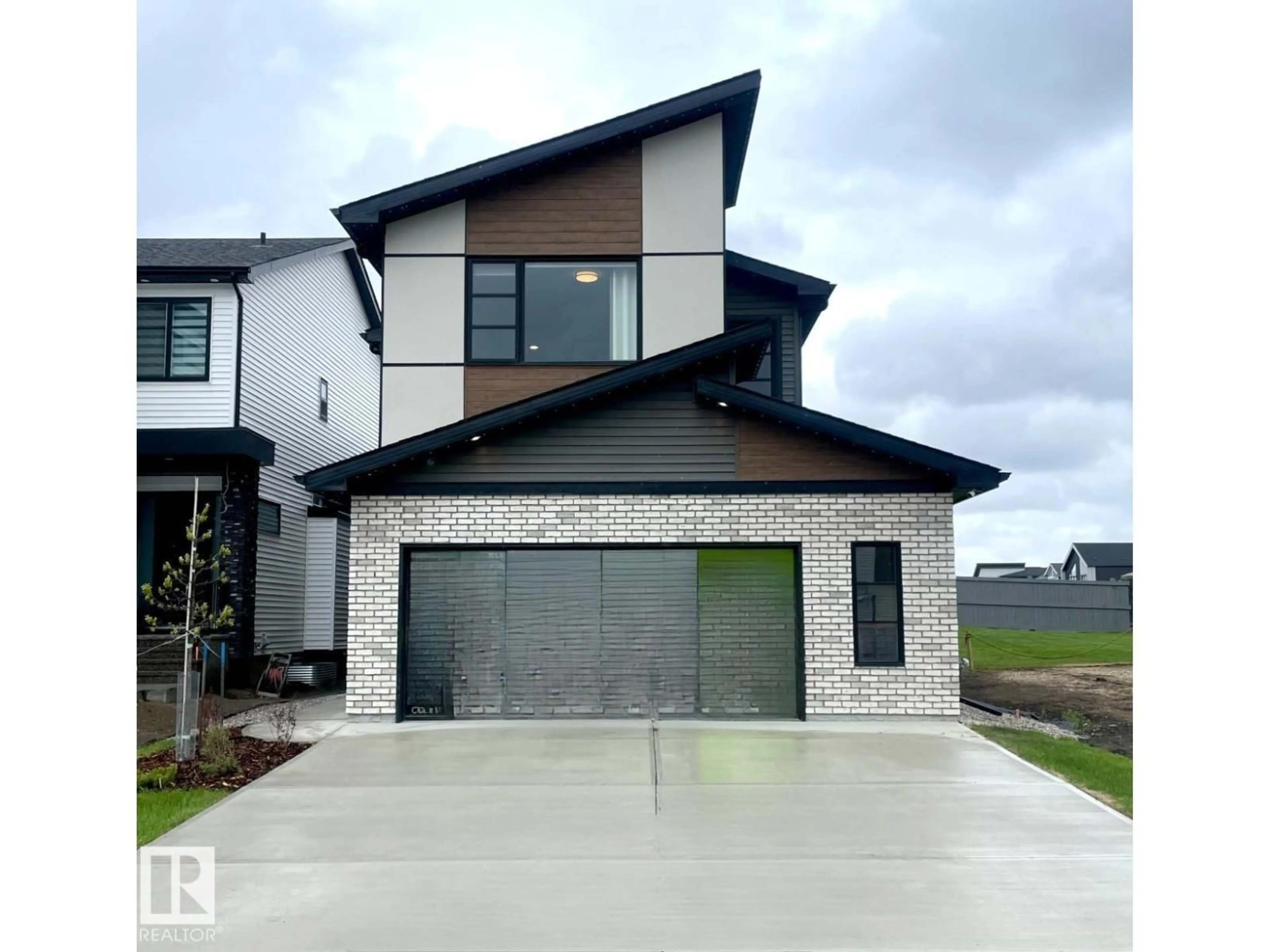 Home with brick exterior material, street for 7005 KIVIAQ CR, Edmonton Alberta T6W1A5