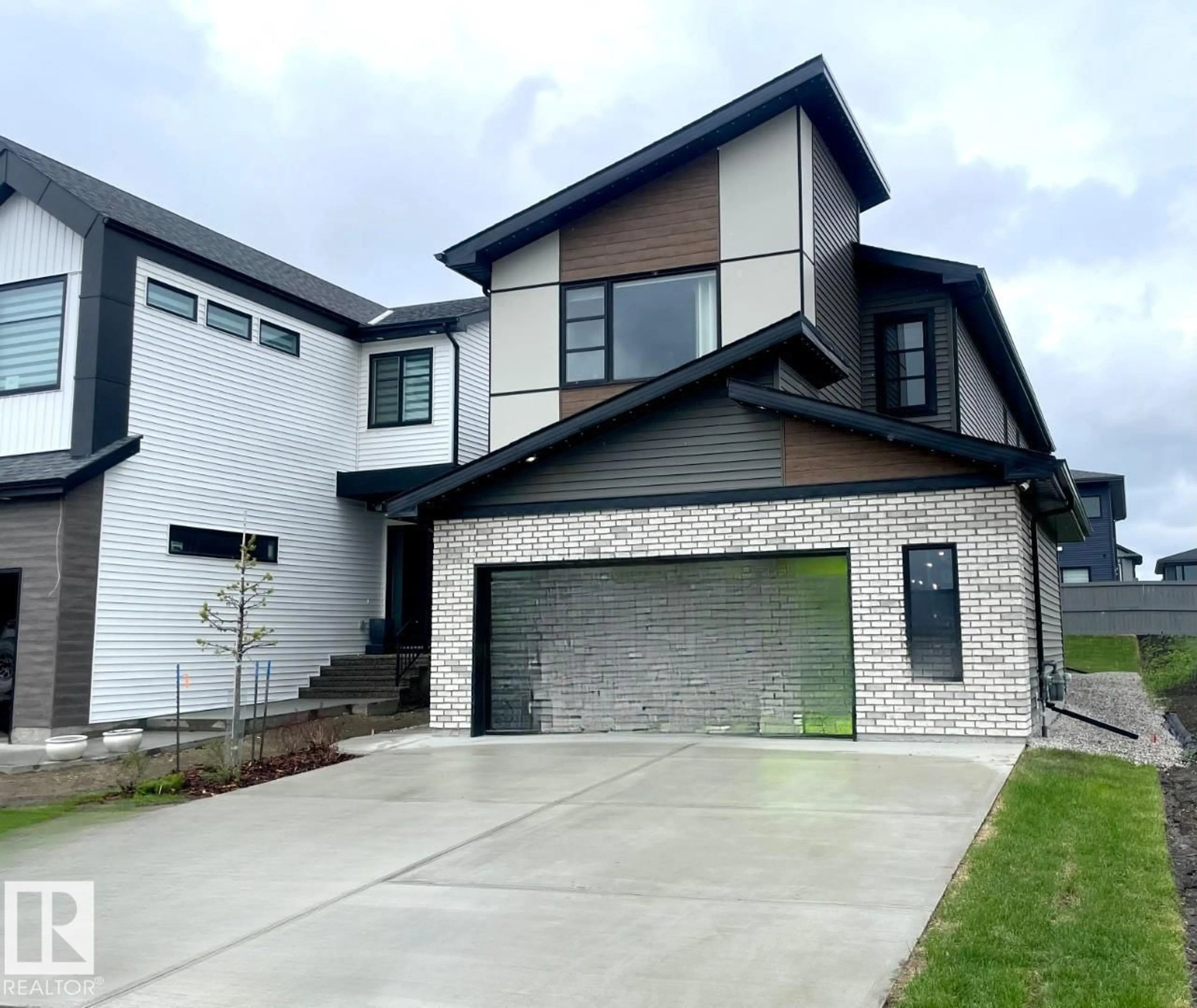 Home with brick exterior material, street for 7005 KIVIAQ CR, Edmonton Alberta T6W1A5