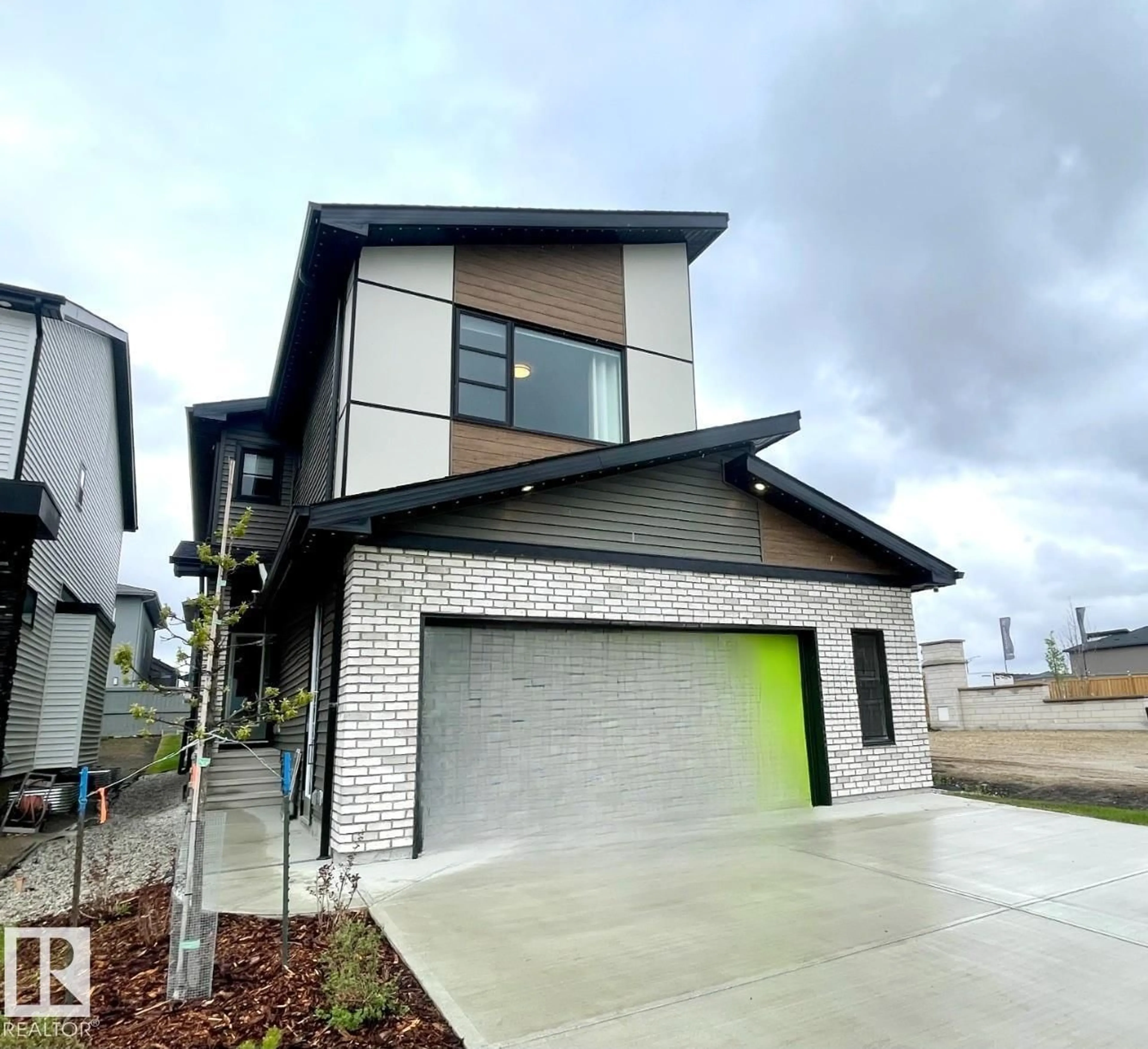 Home with brick exterior material, street for 7005 KIVIAQ CR, Edmonton Alberta T6W1A5