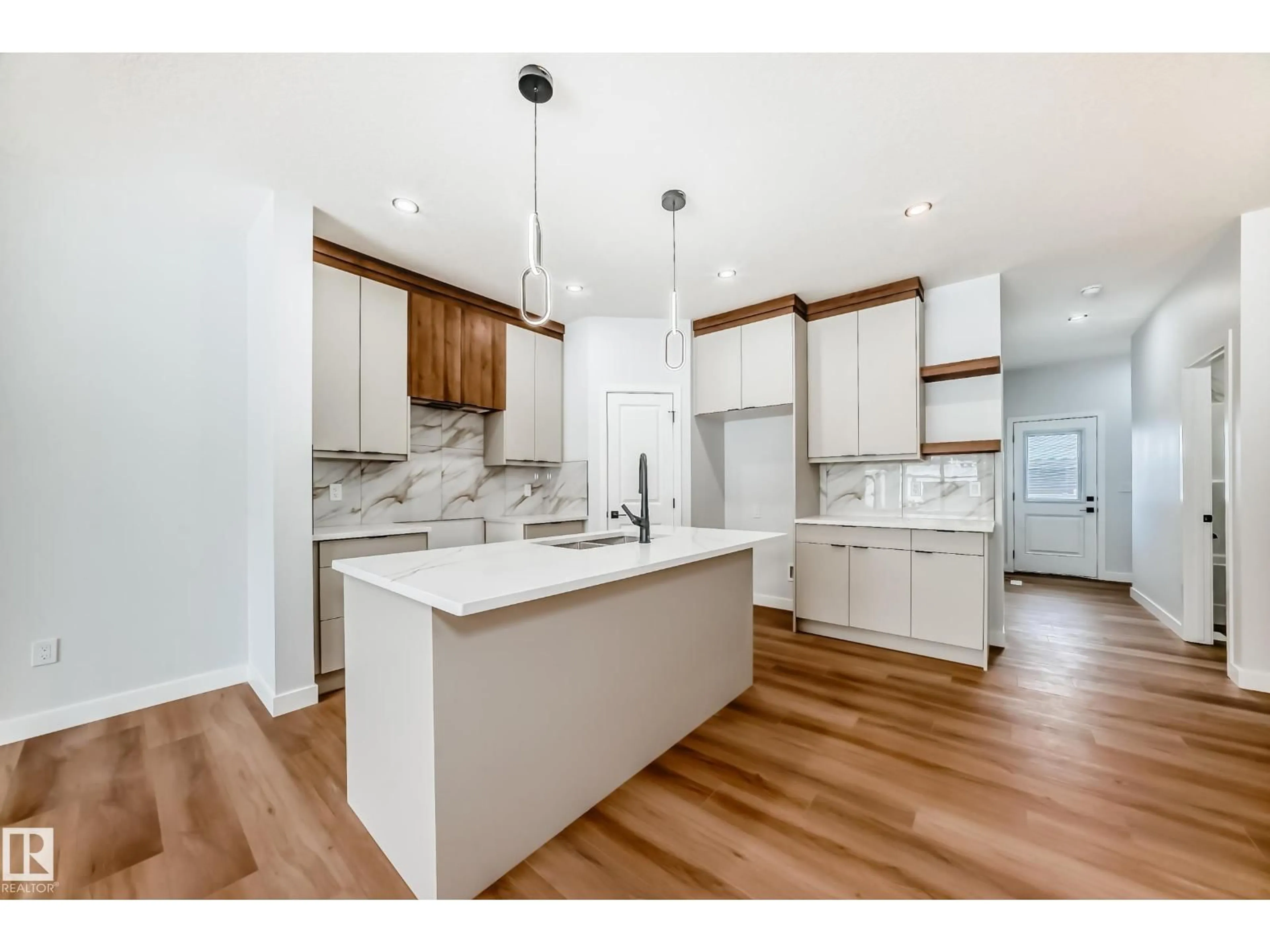 Open concept kitchen, wood/laminate floor for 26 WESTWYCK LI, Spruce Grove Alberta T7X4G1