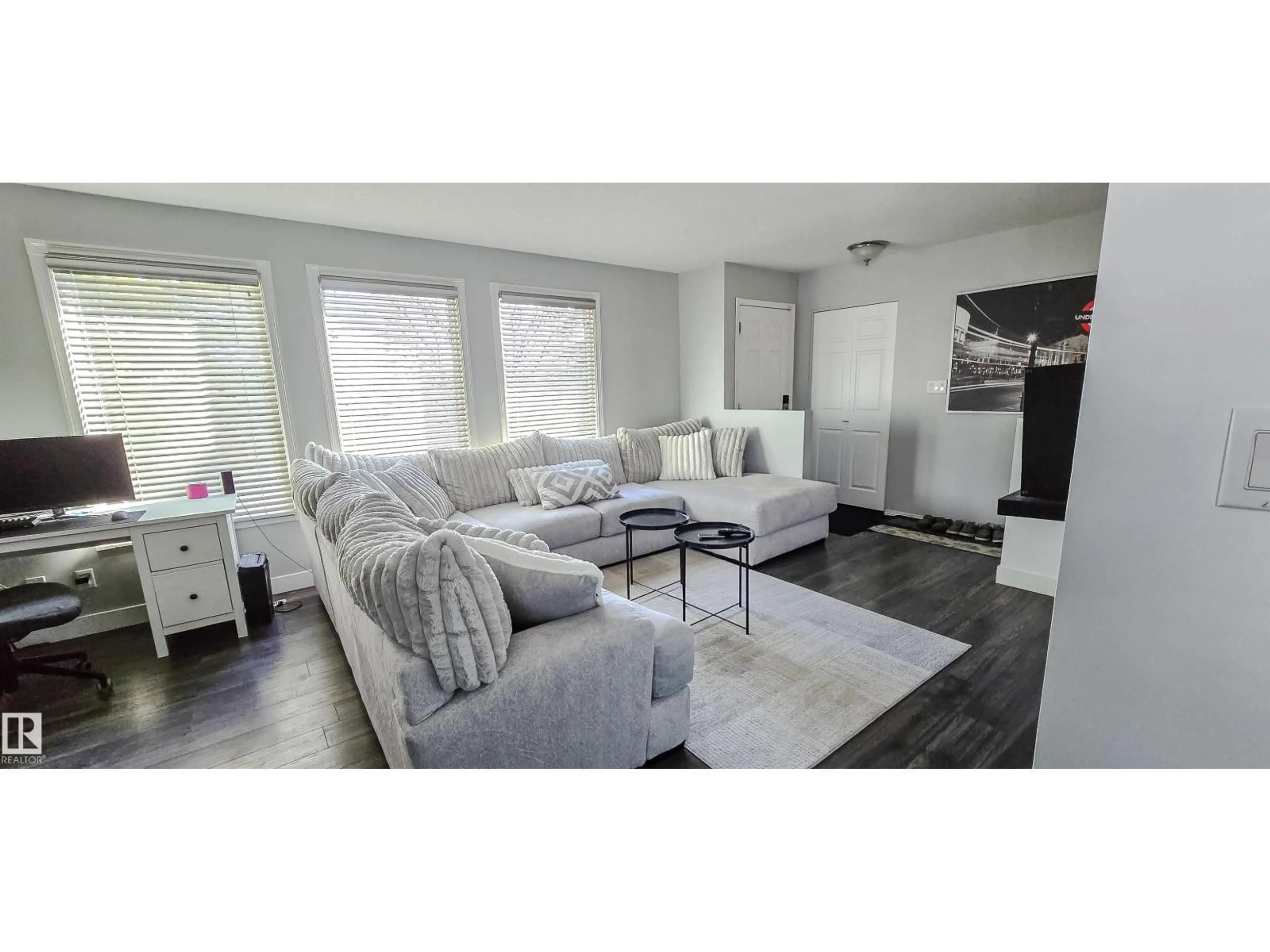 Living room with furniture, wood/laminate floor for 5504 45 AV, Drayton Valley Alberta T7A1K3