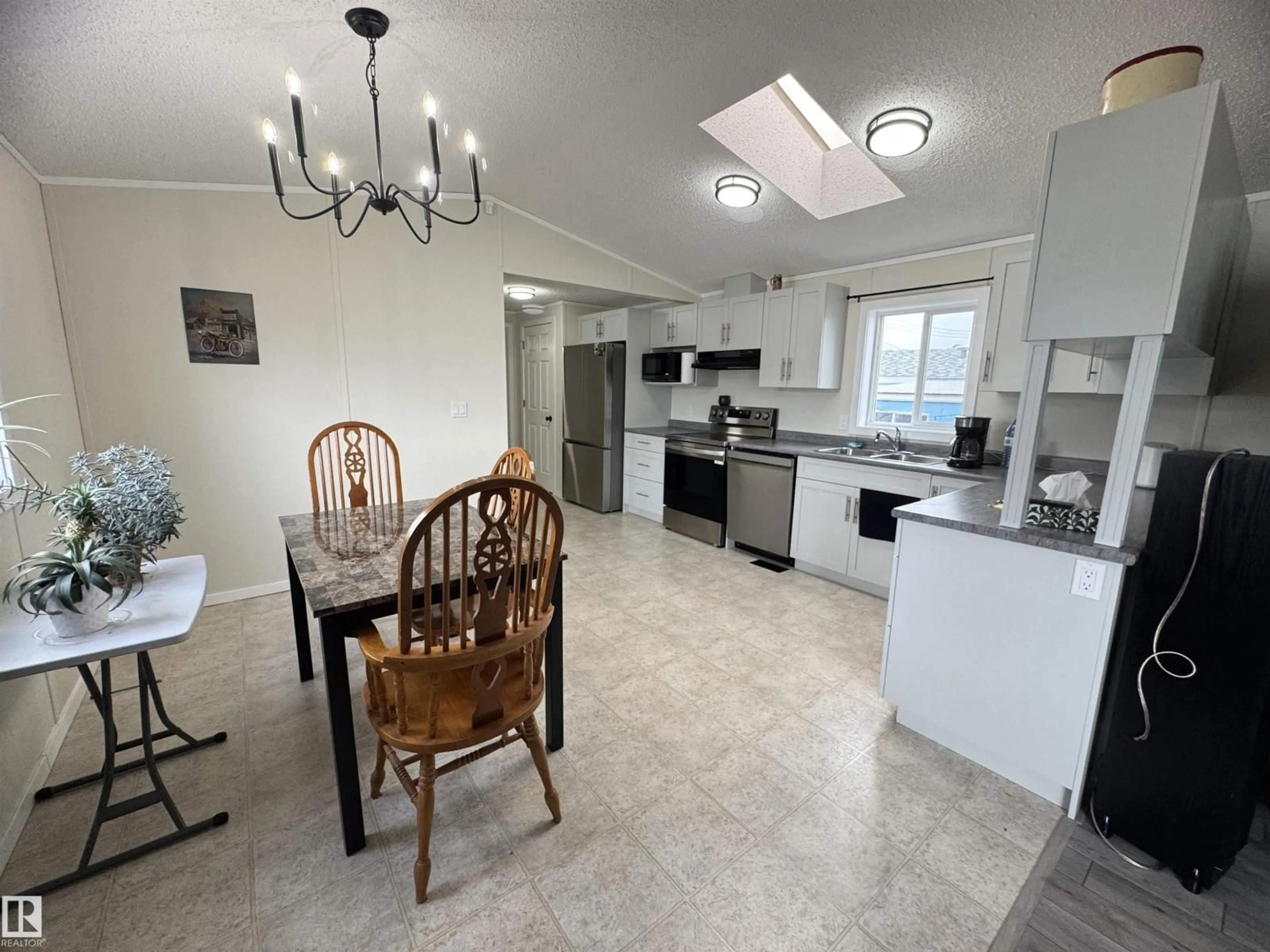 Open concept kitchen, ceramic/tile floor for 9501 - 83 104 AVE, Westlock Alberta T7P1M7