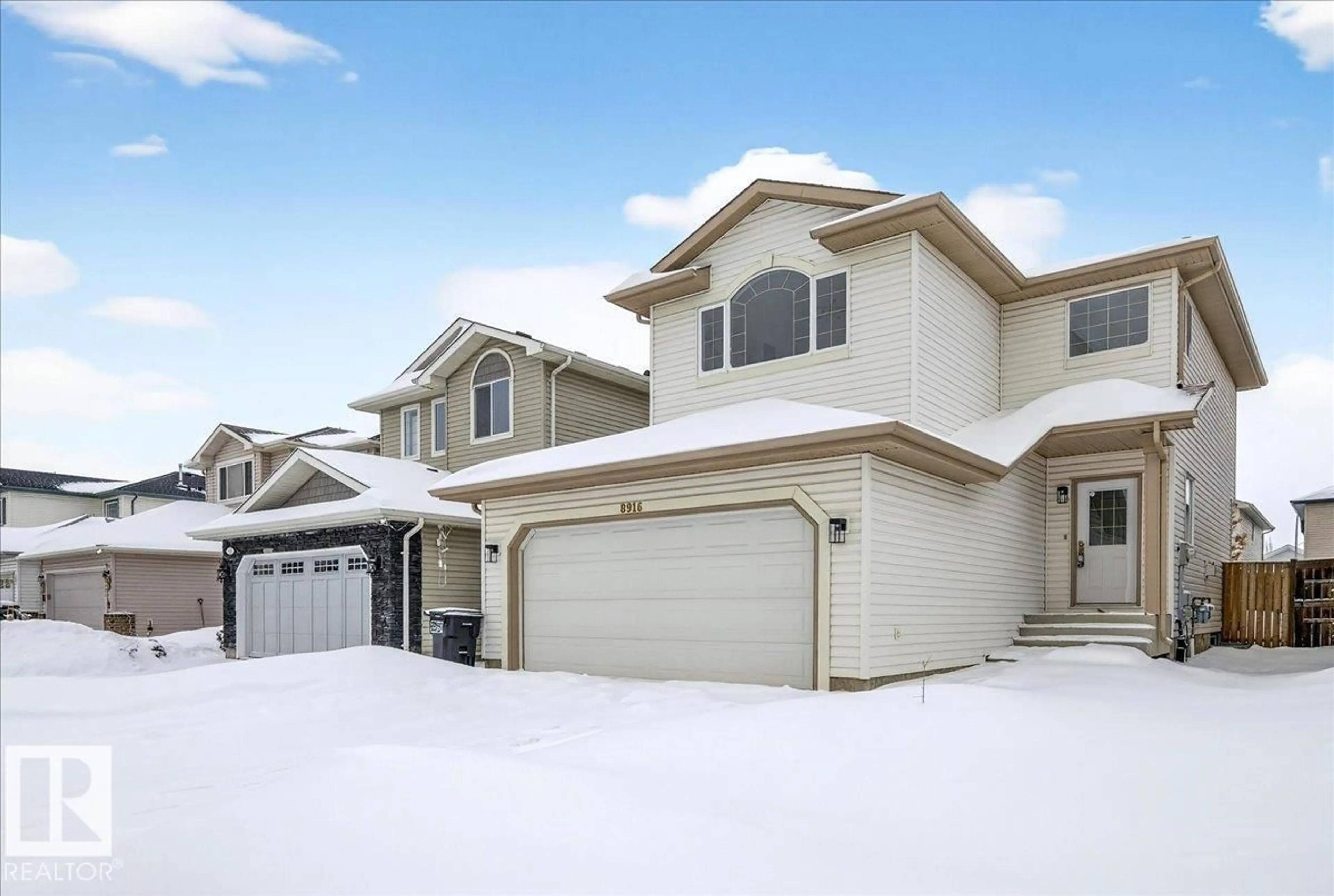Home with vinyl exterior material, street for NW - 8916 175 AV, Edmonton Alberta T5Z3X9
