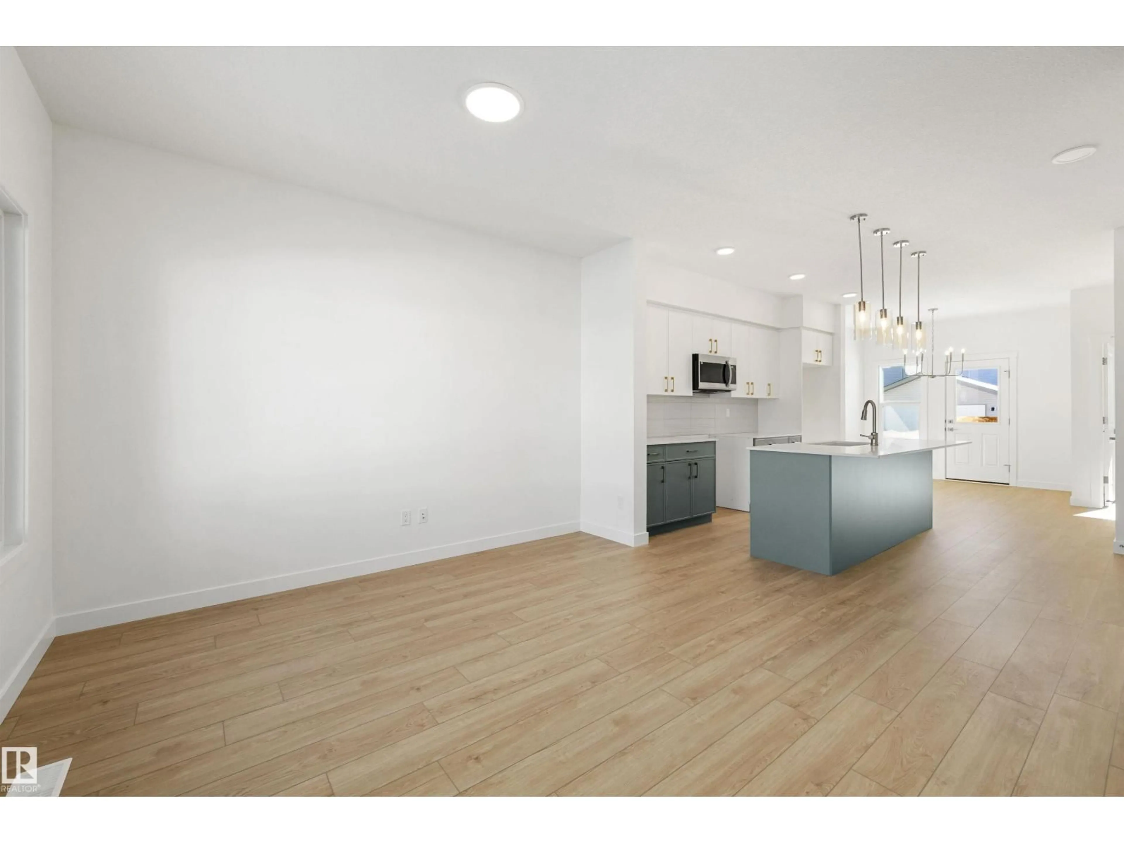 Open concept kitchen, wood/laminate floor for 20711 43 AV, Edmonton Alberta T6M3E3