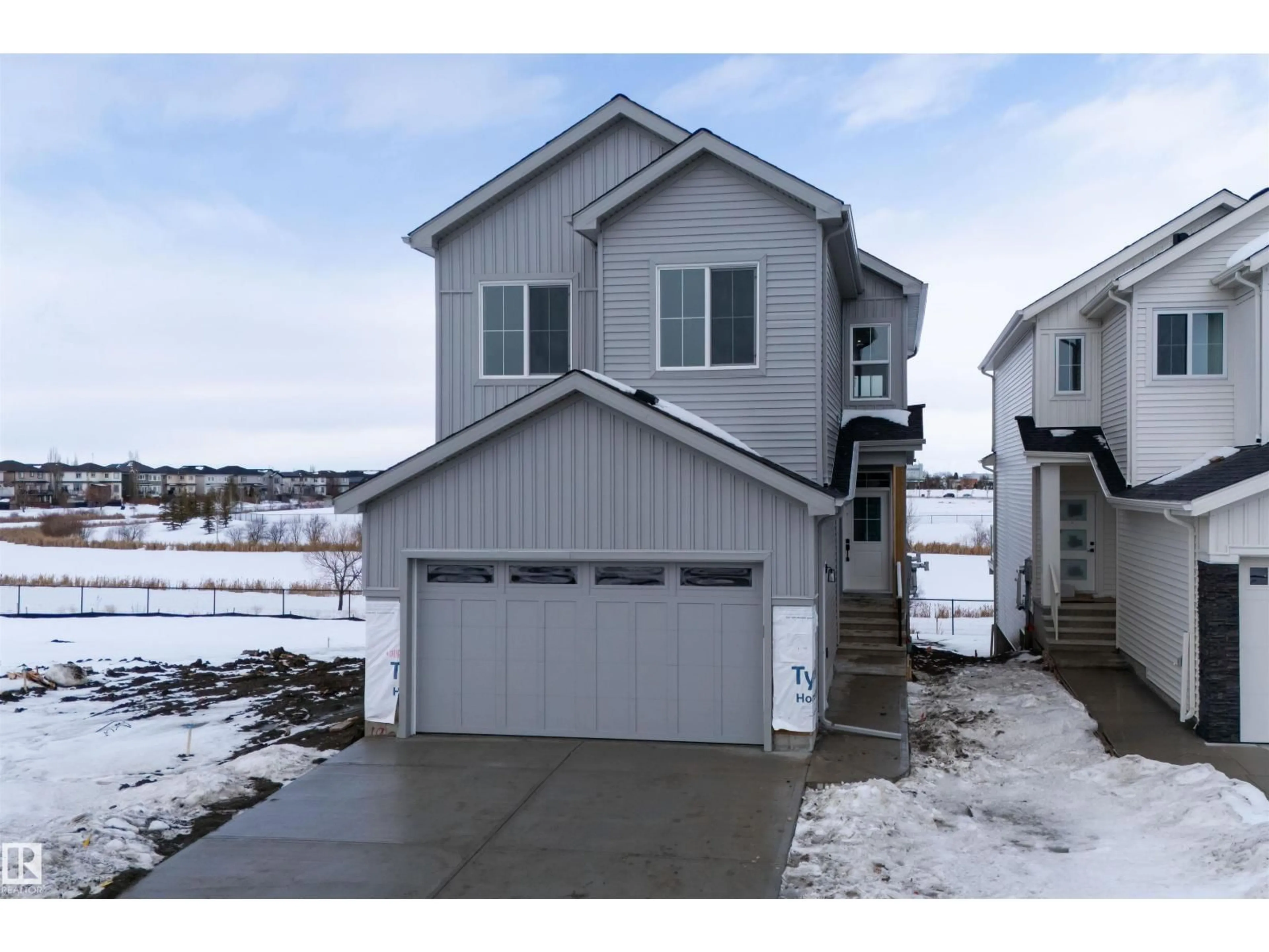 Home with vinyl exterior material, street for 190 ELLIOTT WD, Fort Saskatchewan Alberta T8L0E2