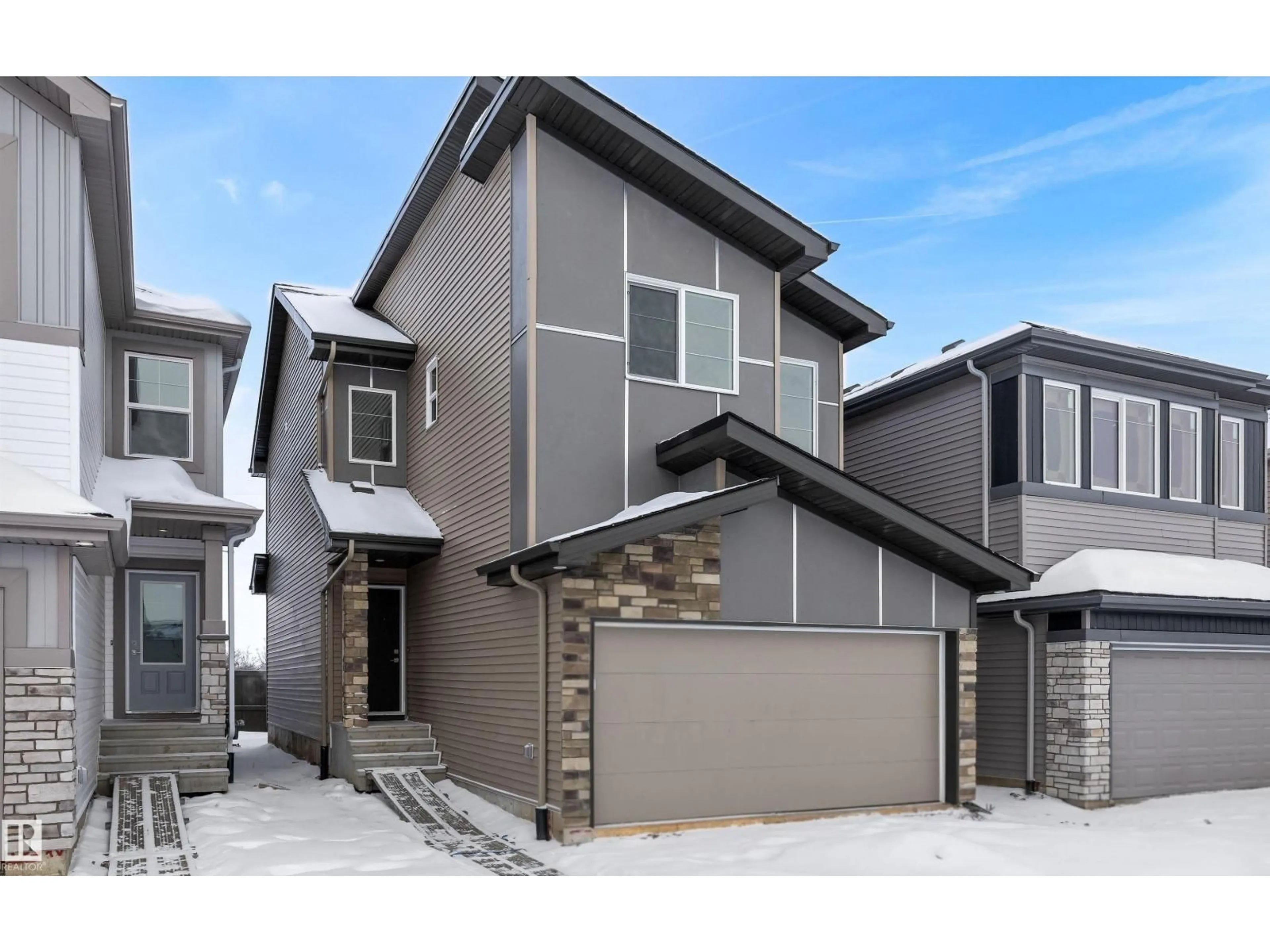 Home with vinyl exterior material, street for 8704 183 AV, Edmonton Alberta T5Z0X5