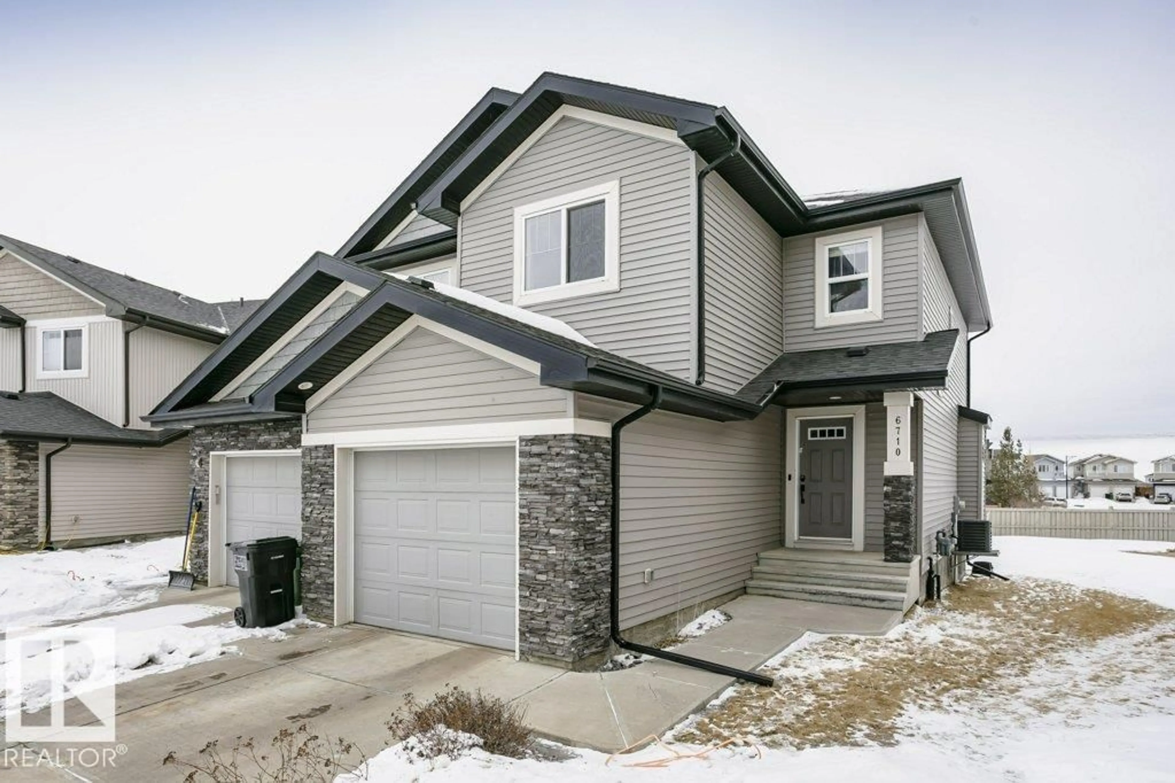 Home with vinyl exterior material, street for 6710 CARDINAL RD, Edmonton Alberta T6W2Y6