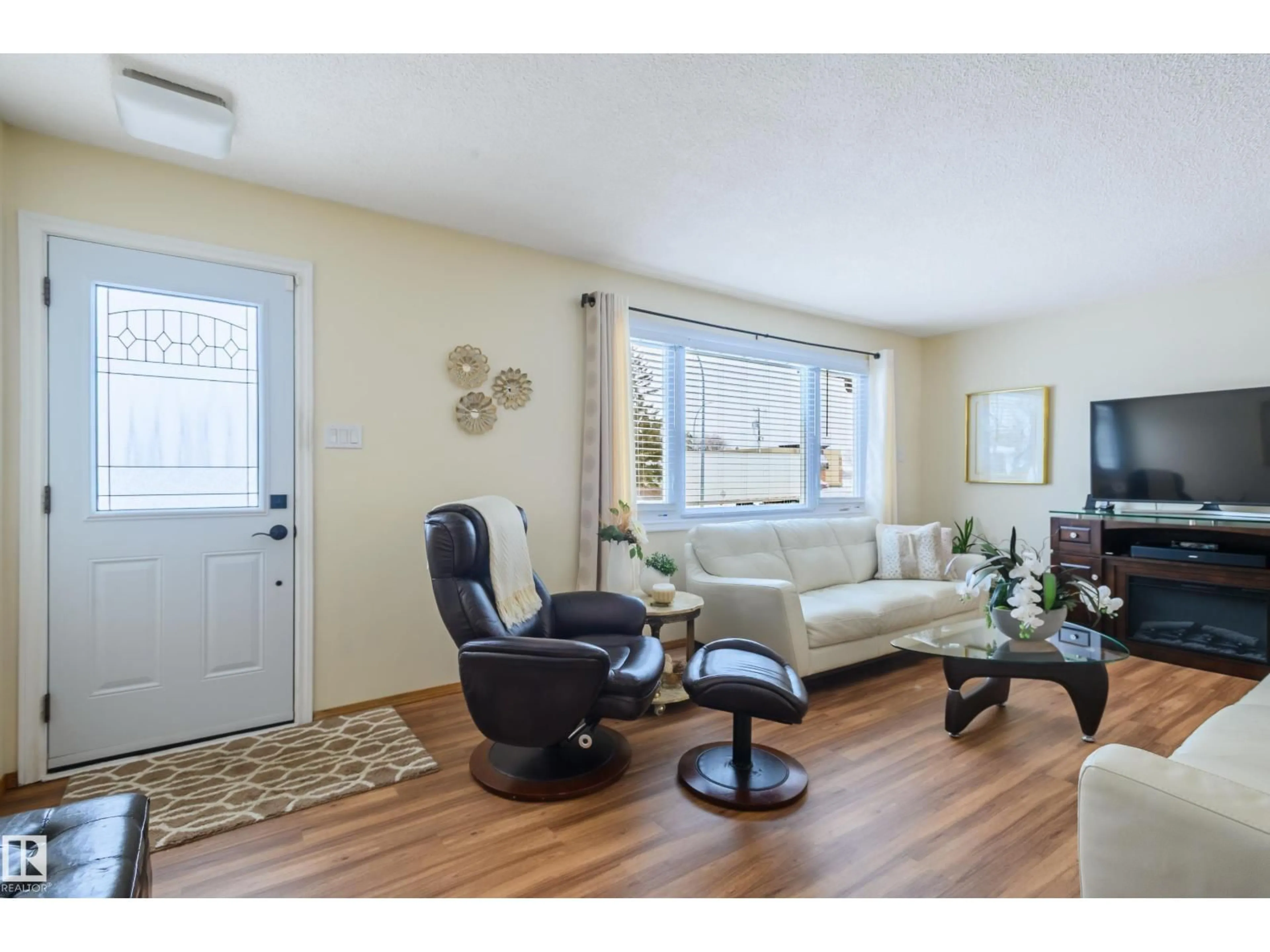 Living room with furniture, wood/laminate floor for NW - 13420 113A ST, Edmonton Alberta T5E5C2