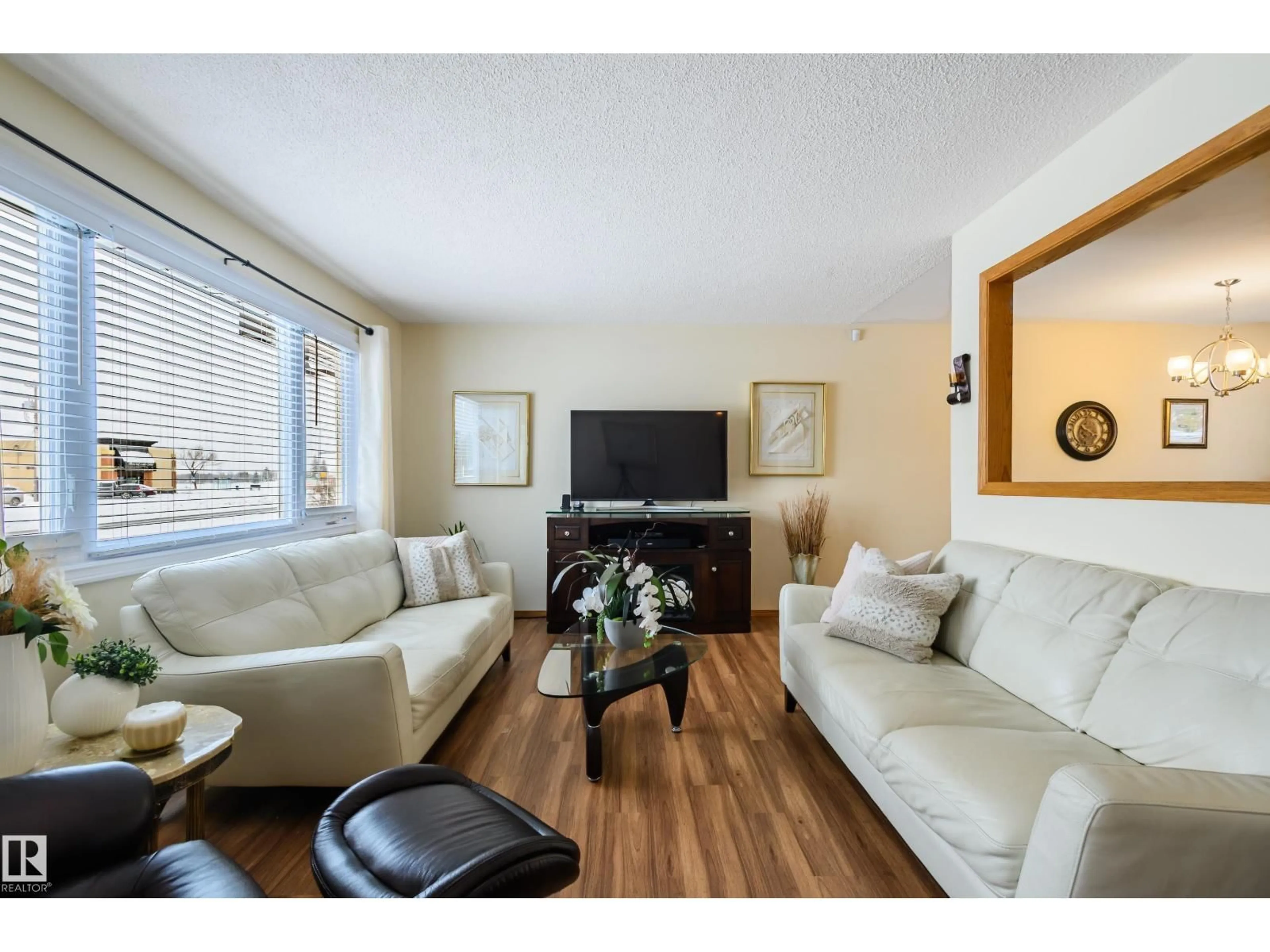 Living room with furniture, wood/laminate floor for NW - 13420 113A ST, Edmonton Alberta T5E5C2