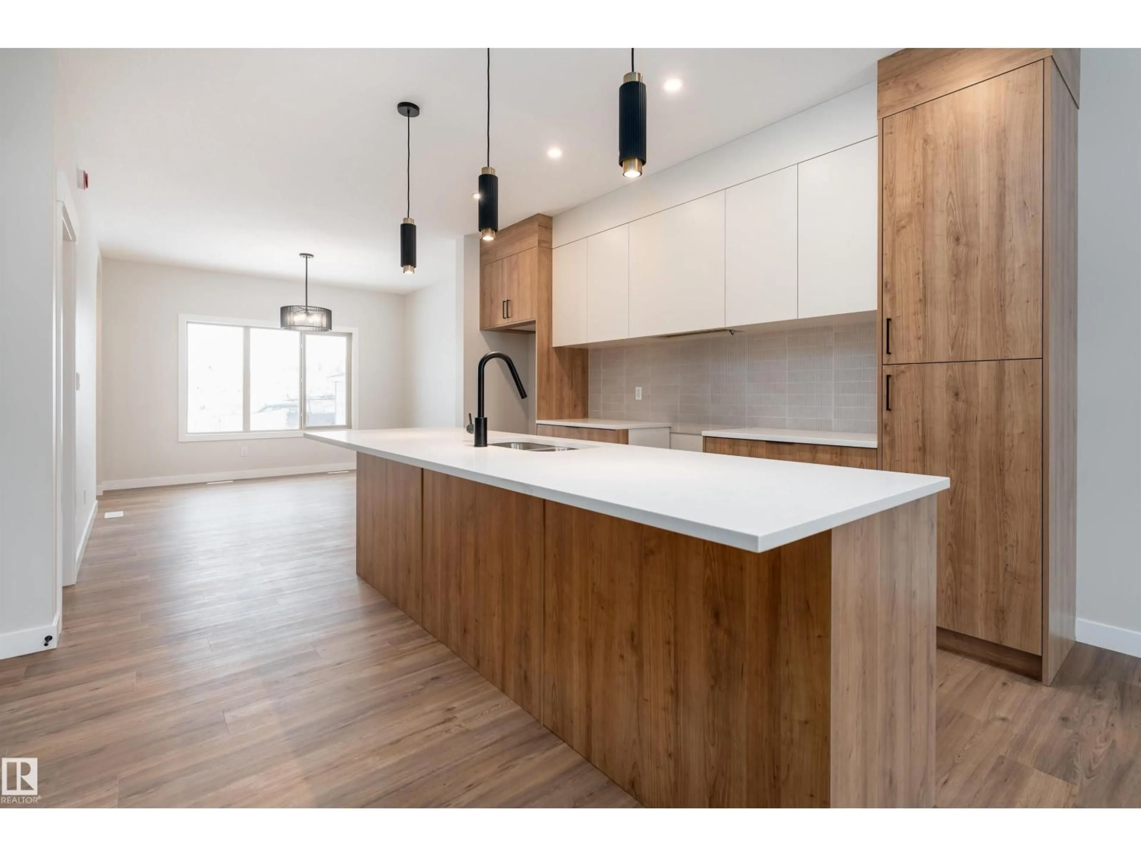 Open concept kitchen, wood/laminate floor for 128 GARNEAU GA, Spruce Grove Alberta T7X2Y6