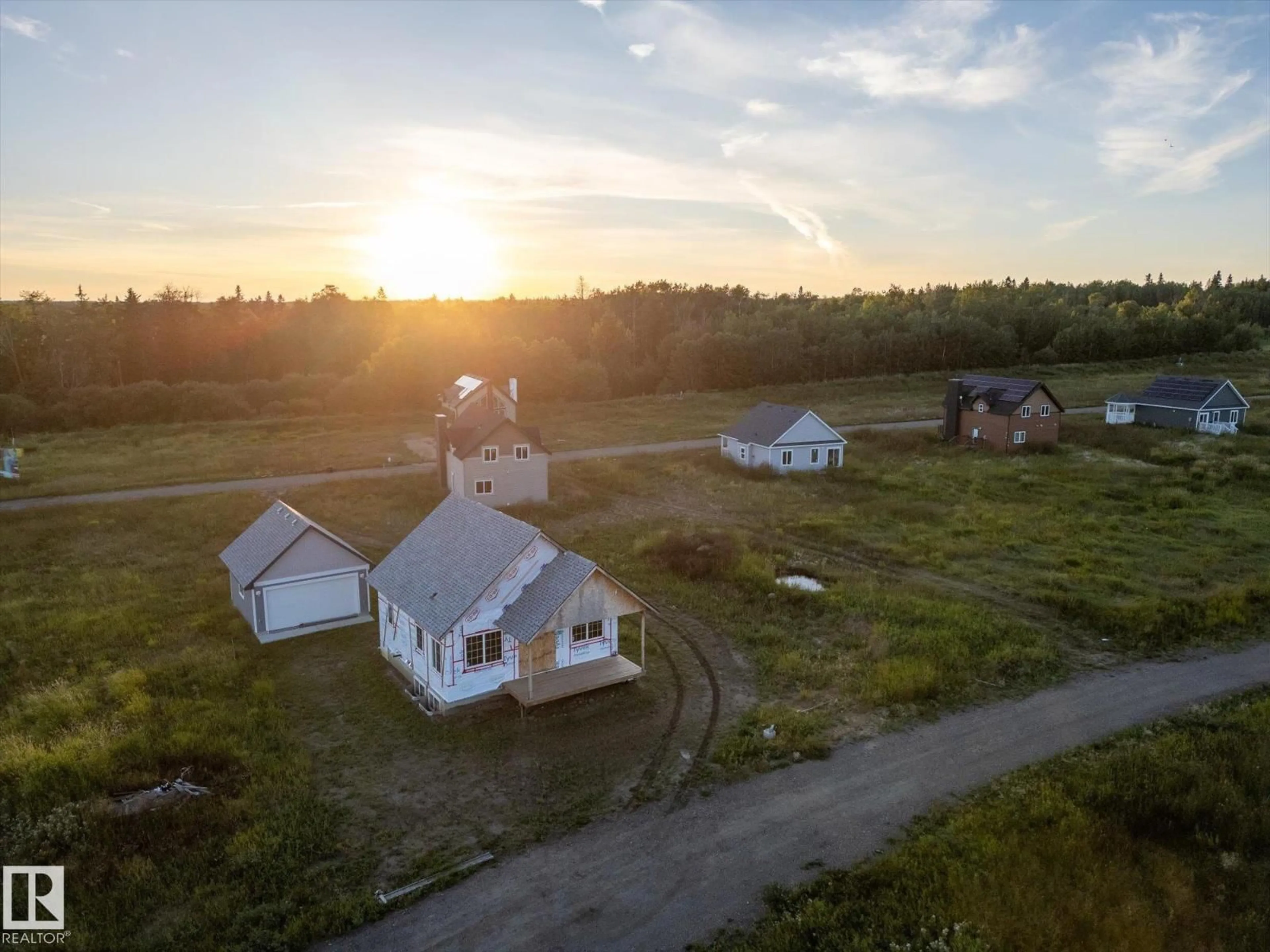 A pic from outside/outdoor area/front of a property/back of a property/a pic from drone, building for 49 - 5323 TOWNSHIP ROAD 541A, Rural Lac Ste. Anne County Alberta T0E1H0