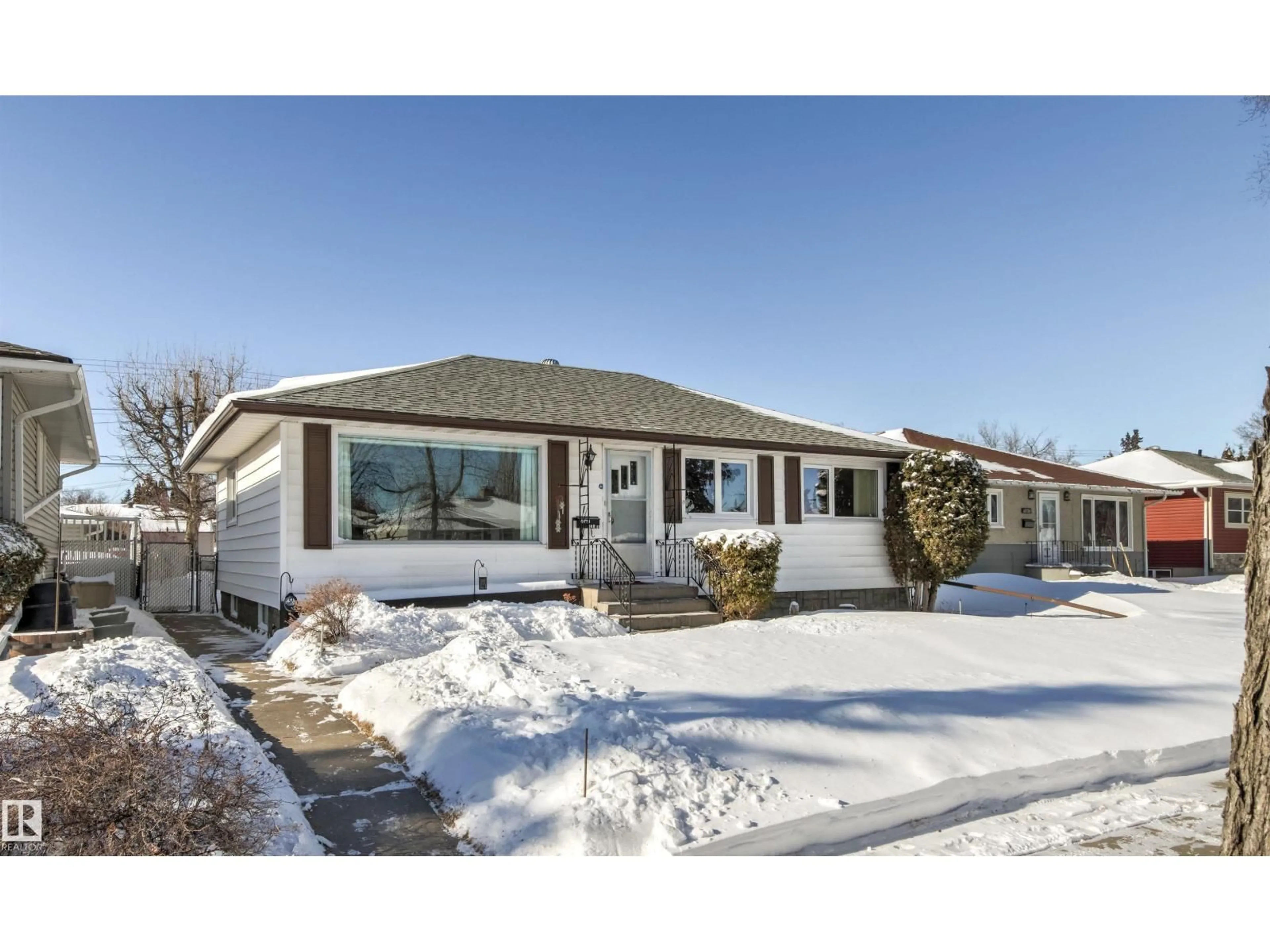 Home with vinyl exterior material, street for NW - 10724 148 ST, Edmonton Alberta T5N3H2