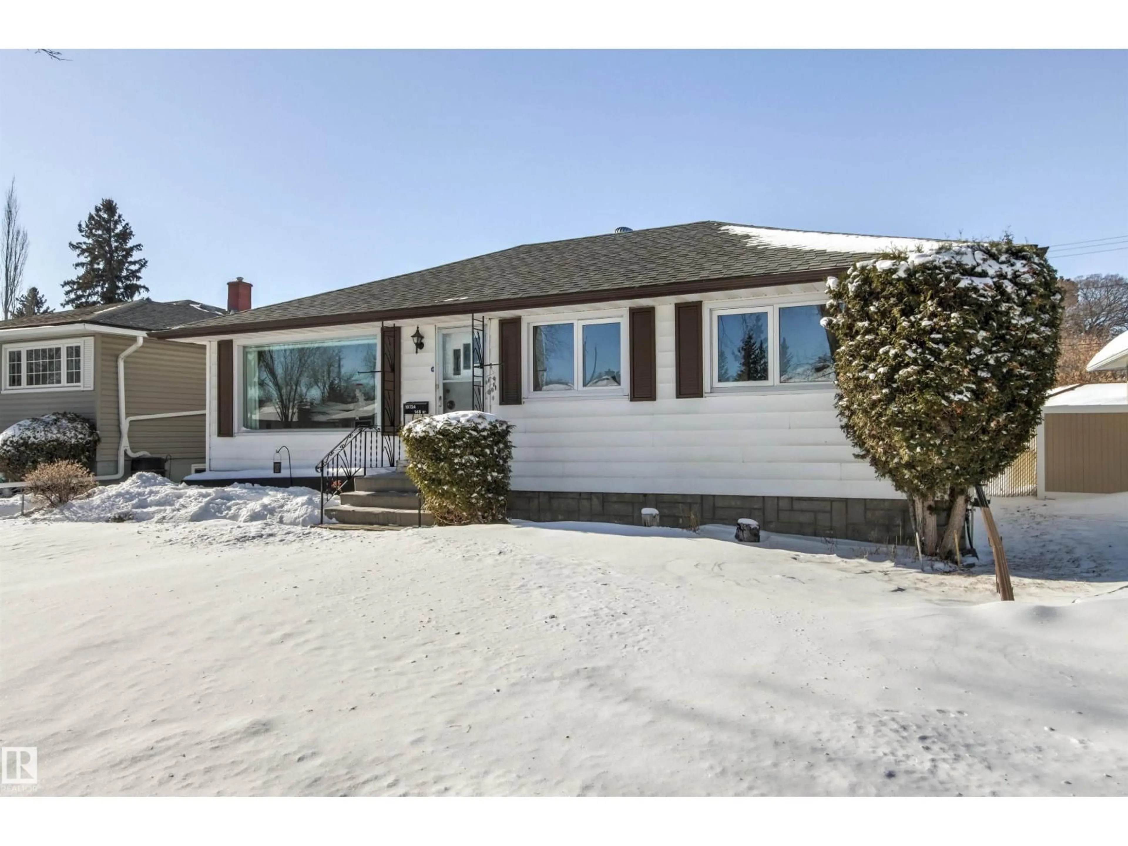 Home with vinyl exterior material, street for NW - 10724 148 ST, Edmonton Alberta T5N3H2