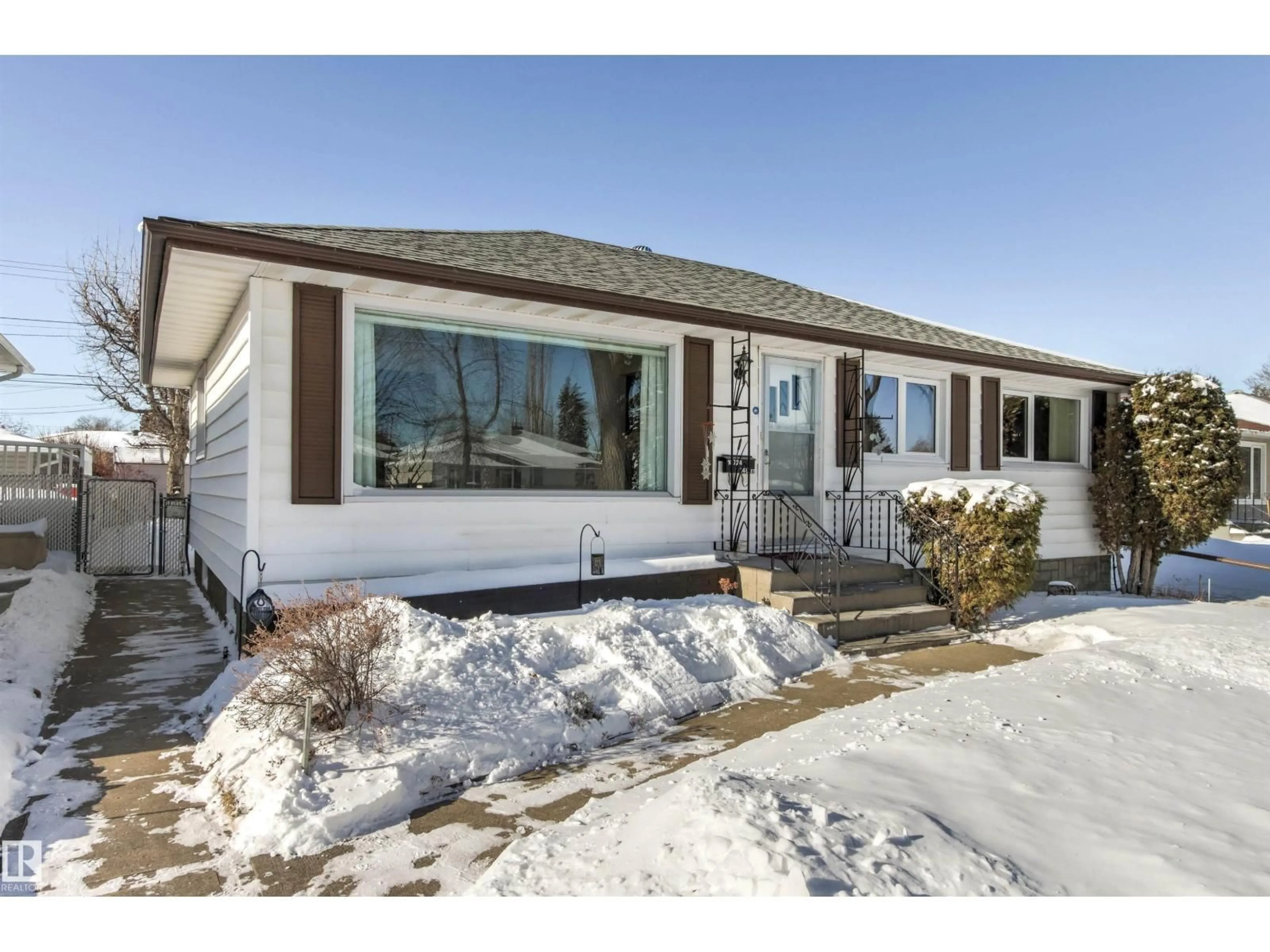 Home with vinyl exterior material, street for NW - 10724 148 ST, Edmonton Alberta T5N3H2