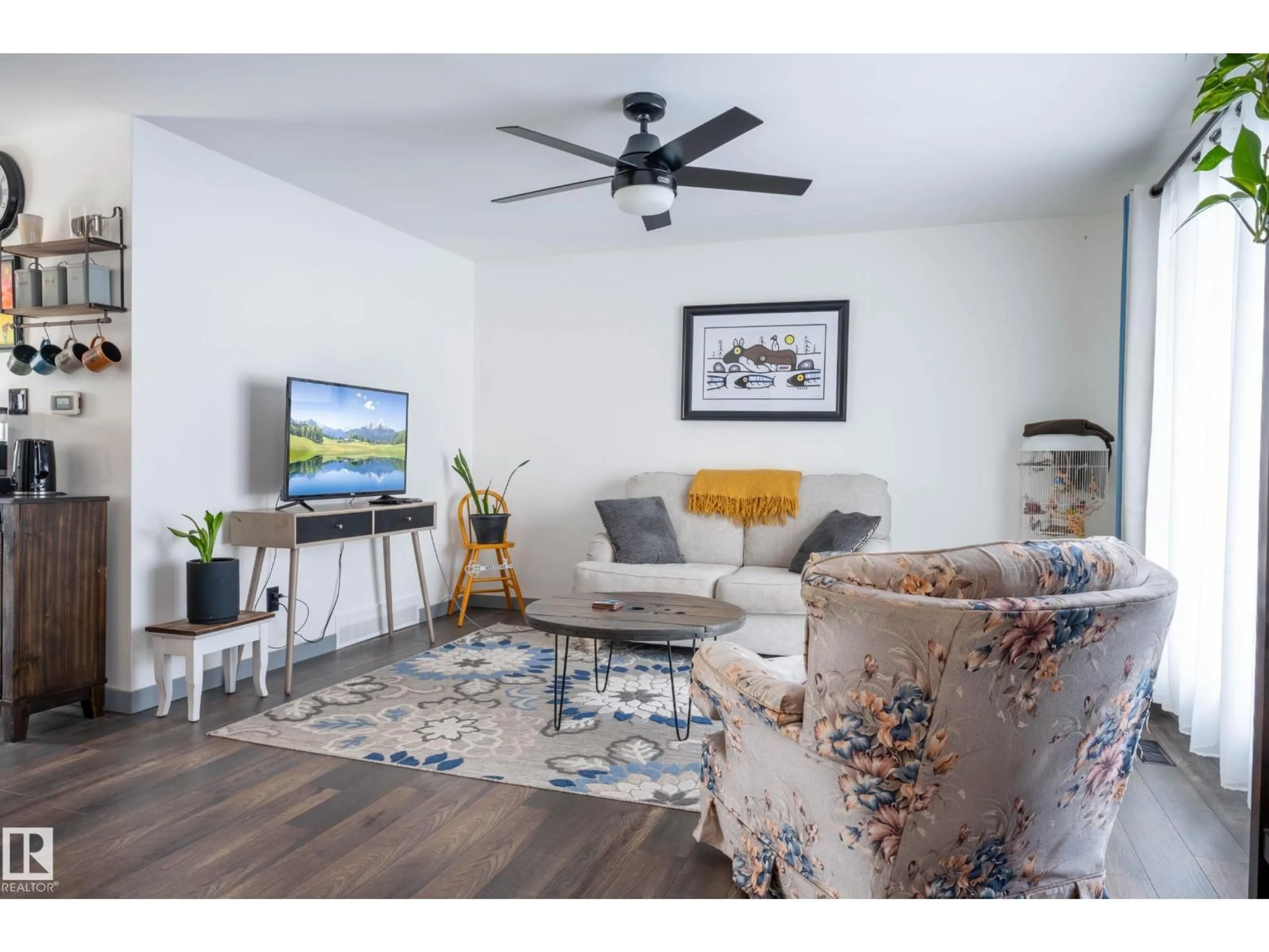 Living room with furniture, wood/laminate floor for 2009 4 AV, Cold Lake Alberta T9M1E1