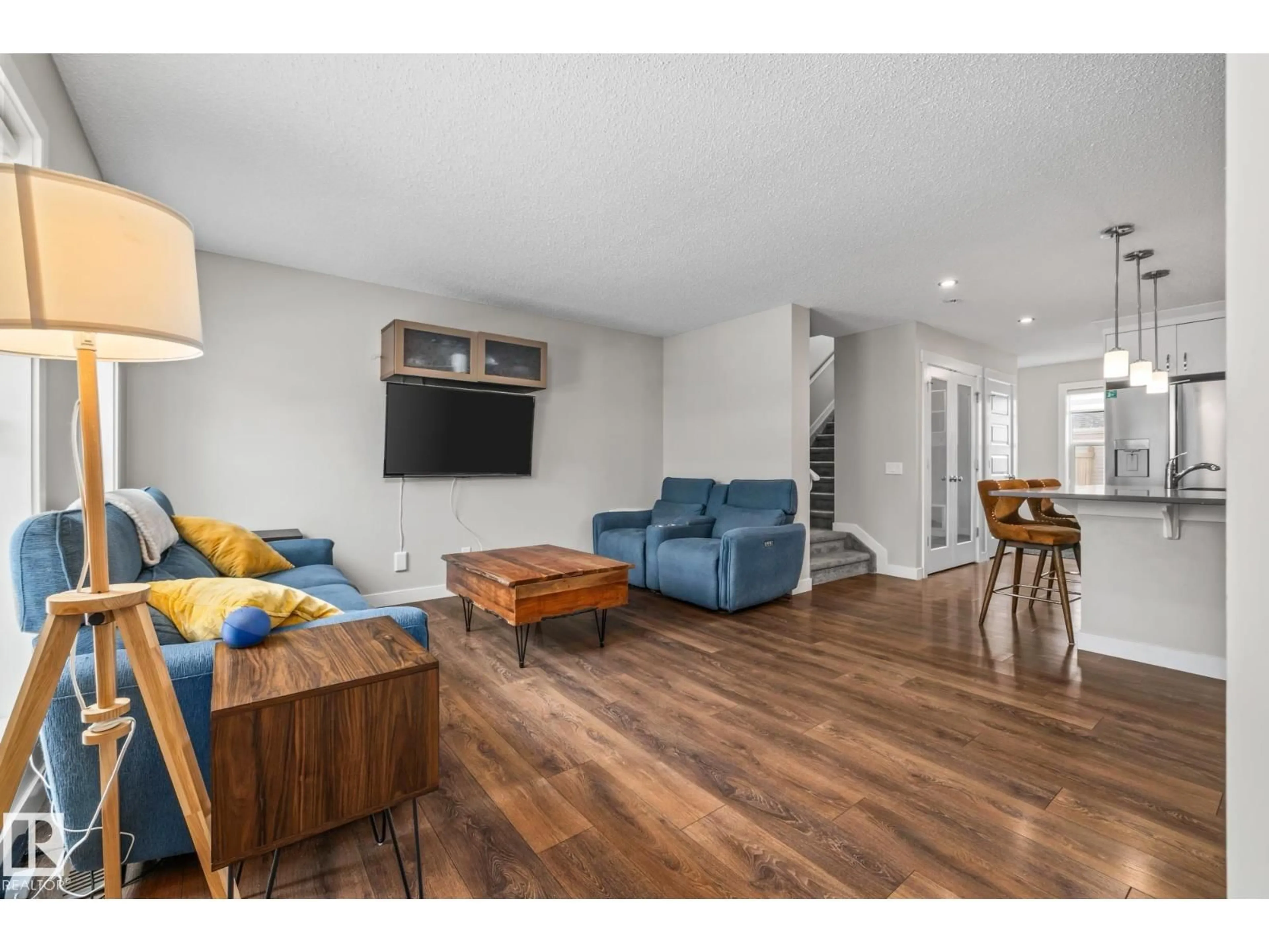 Living room with furniture, wood/laminate floor for 1315 CHAPPELLE BV, Edmonton Alberta T6W3S2