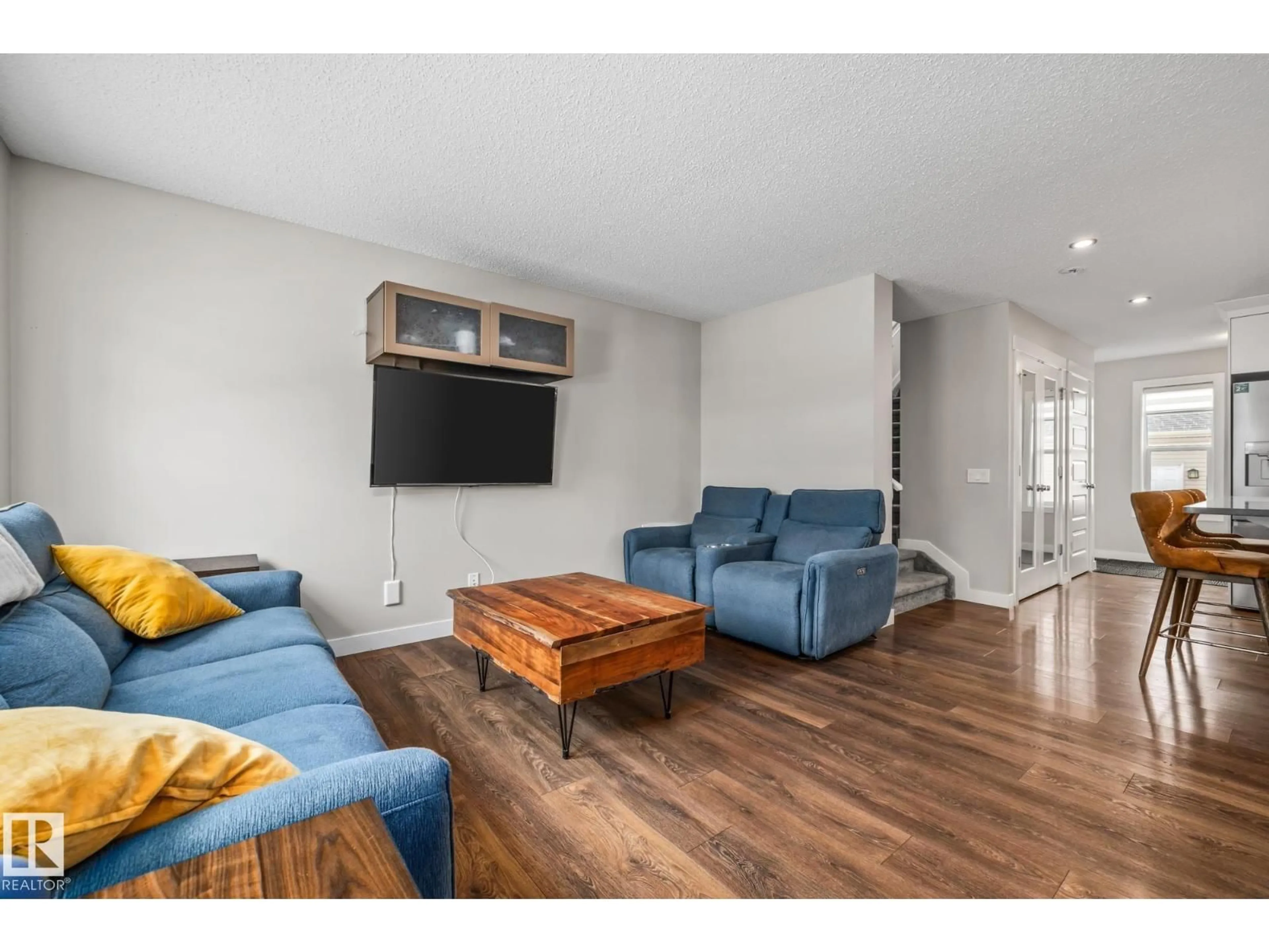 Living room with furniture, wood/laminate floor for 1315 CHAPPELLE BV, Edmonton Alberta T6W3S2