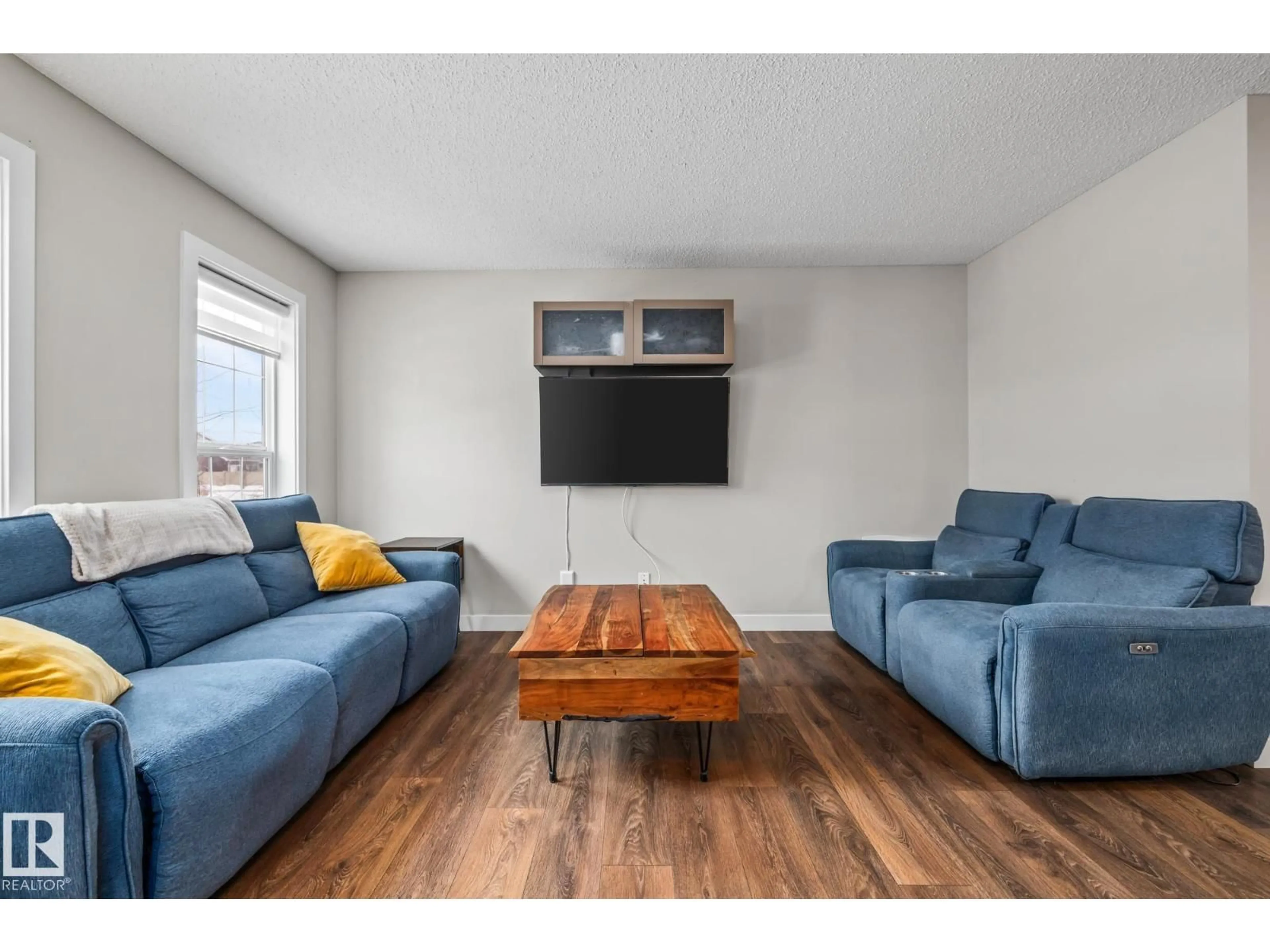 Living room with furniture, wood/laminate floor for 1315 CHAPPELLE BV, Edmonton Alberta T6W3S2