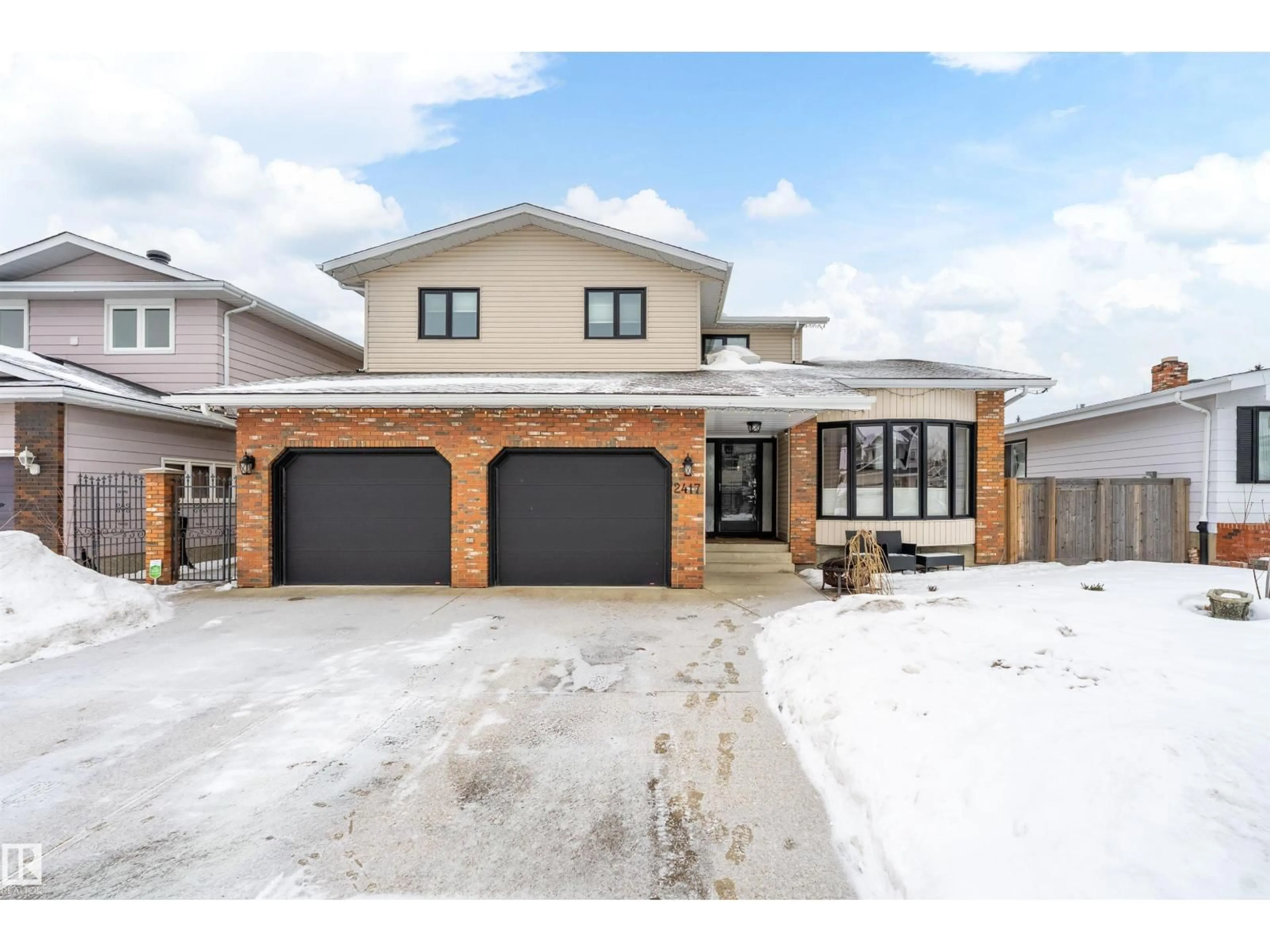 Home with brick exterior material, street for NW - 2417 111B ST, Edmonton Alberta T6J4P8