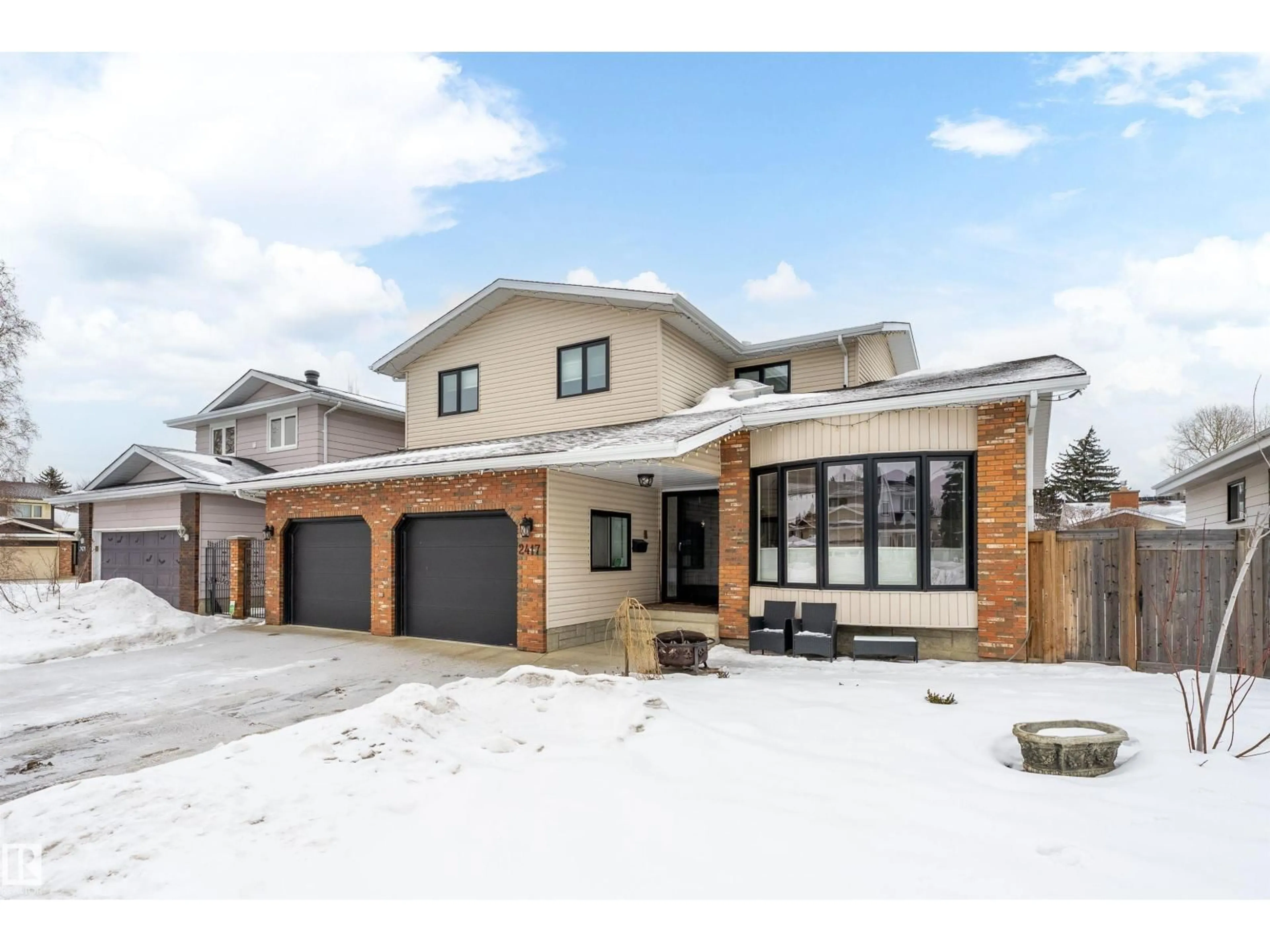 Home with brick exterior material, street for NW - 2417 111B ST, Edmonton Alberta T6J4P8