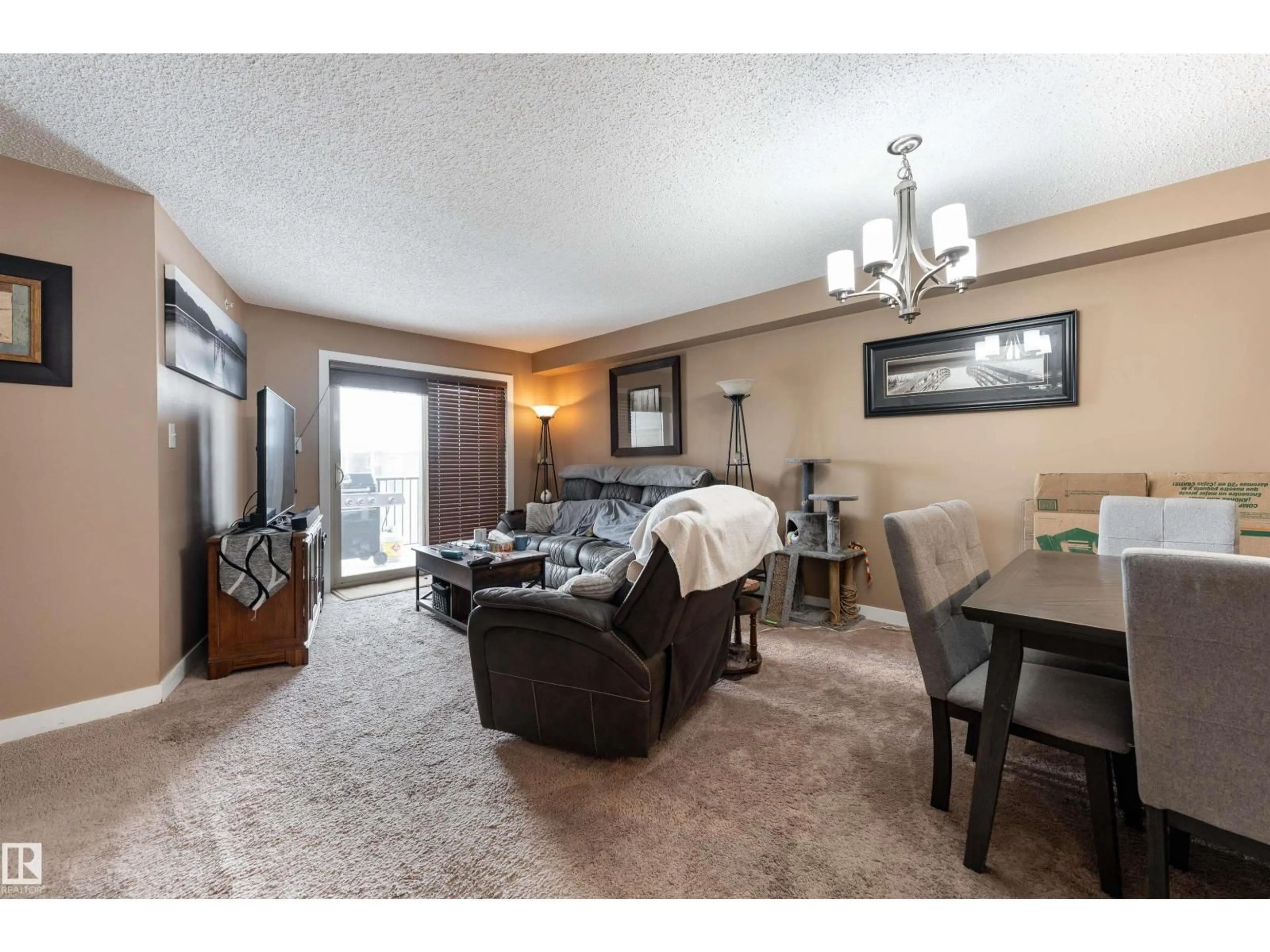 Living room with furniture, unknown for 270 - 422 MCCONACHIE DR, Edmonton Alberta T5Y3N4