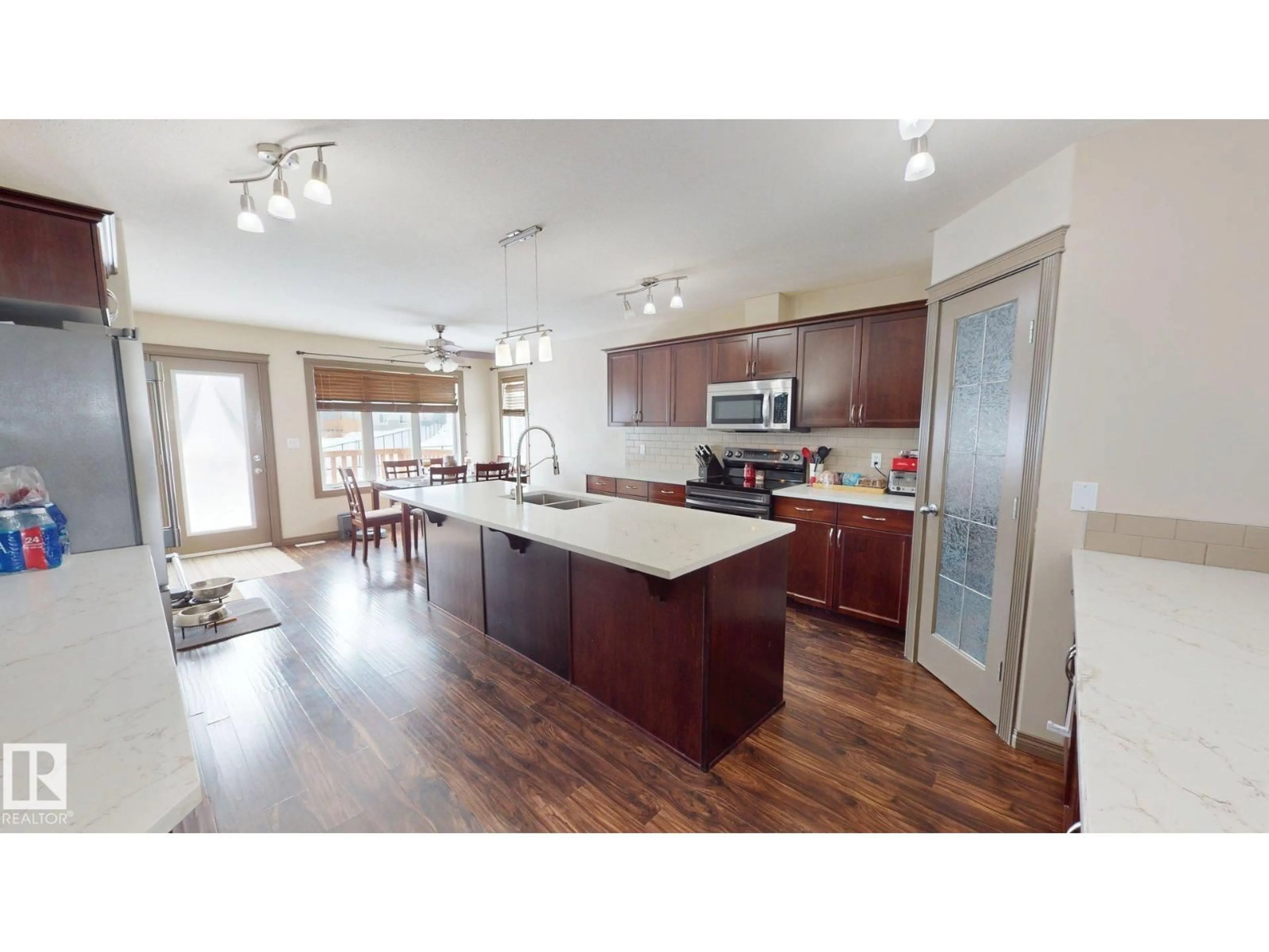 Open concept kitchen, wood/laminate floor for 4464 38 ST, Drayton Valley Alberta T7A0A8