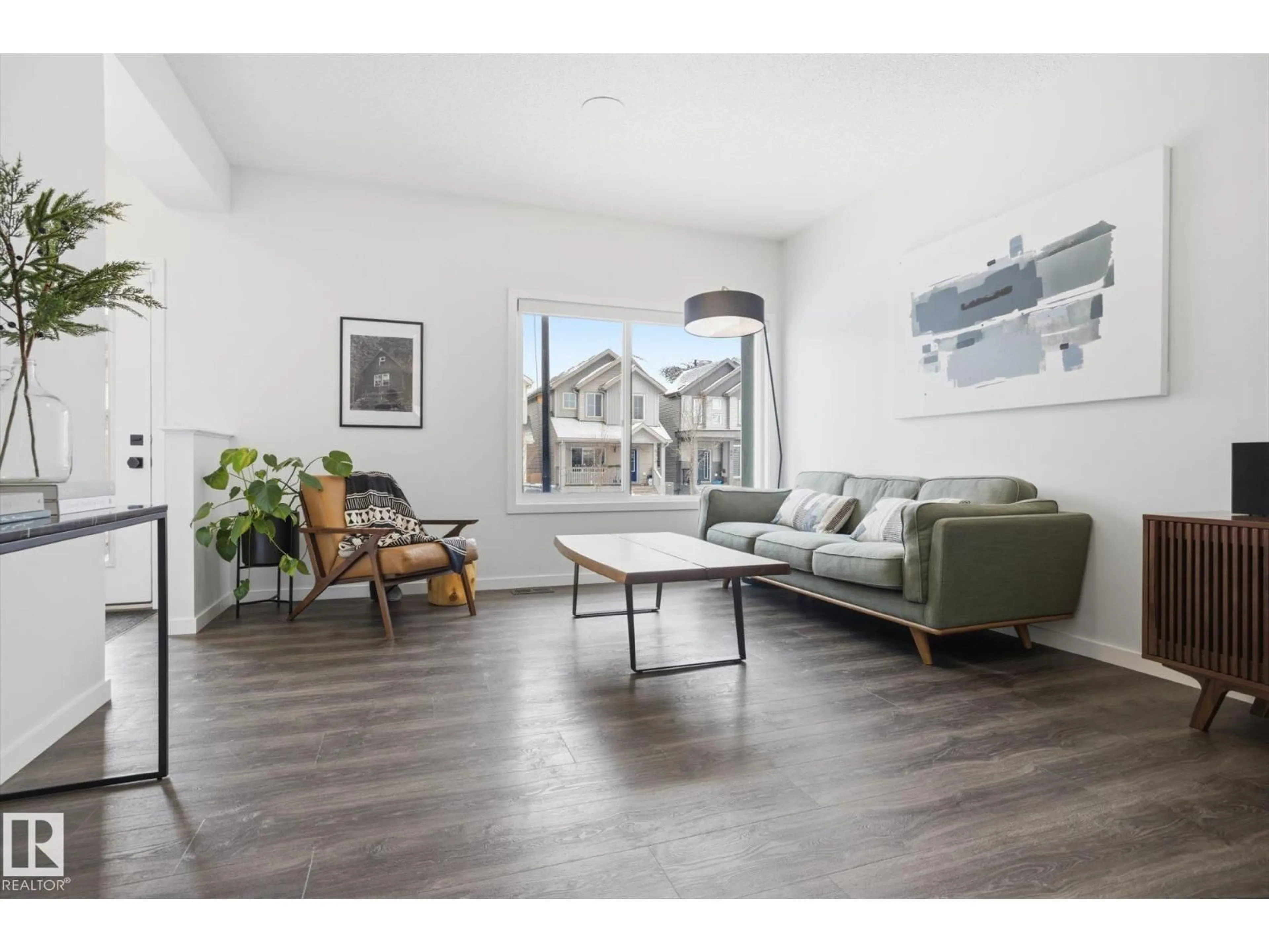 Living room with furniture, wood/laminate floor for 347 DESROCHERS BV, Edmonton Alberta T6W3J2