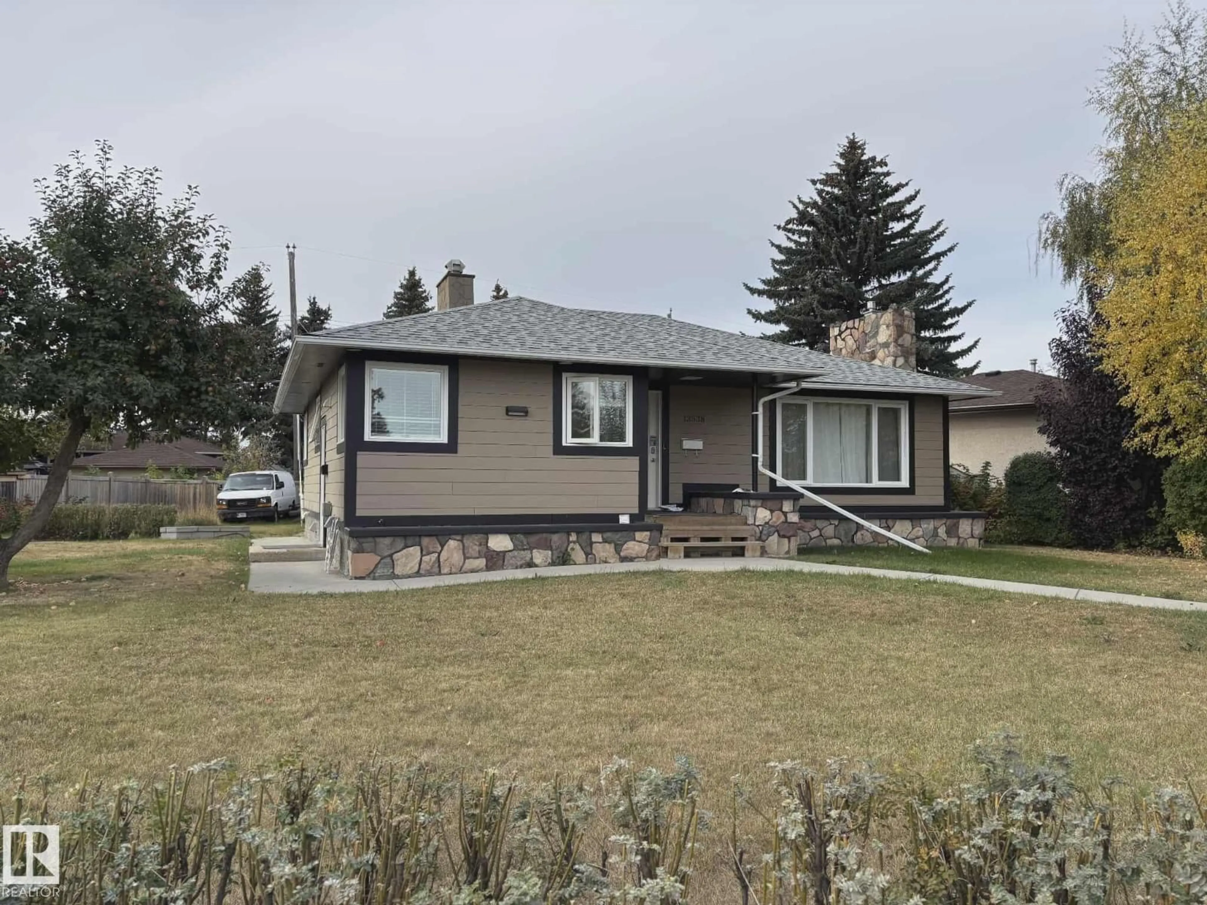 Home with vinyl exterior material, street for 13538 127 ST, Edmonton Alberta T5L1B9