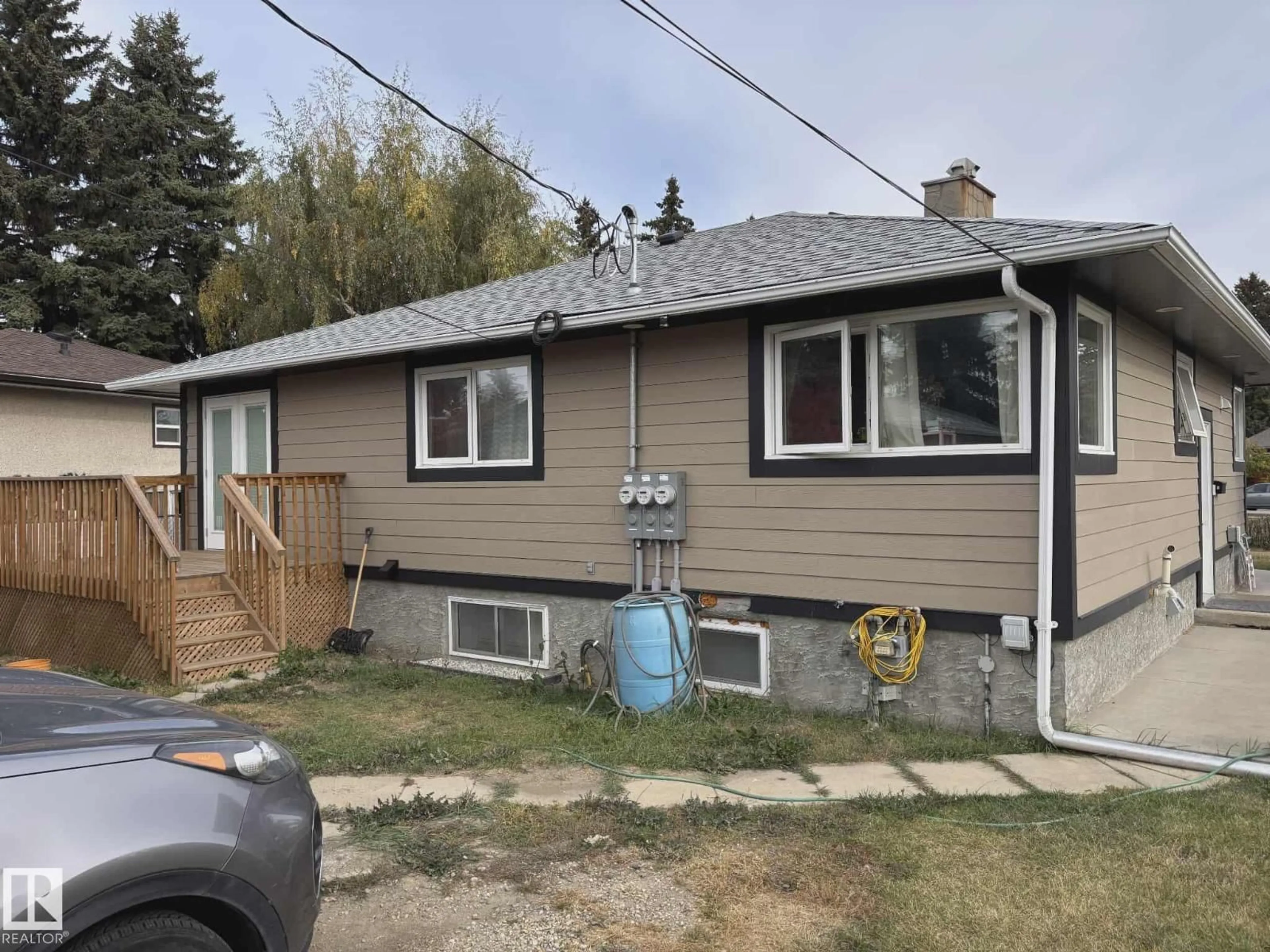 Home with vinyl exterior material, street for 13538 127 ST, Edmonton Alberta T5L1B9