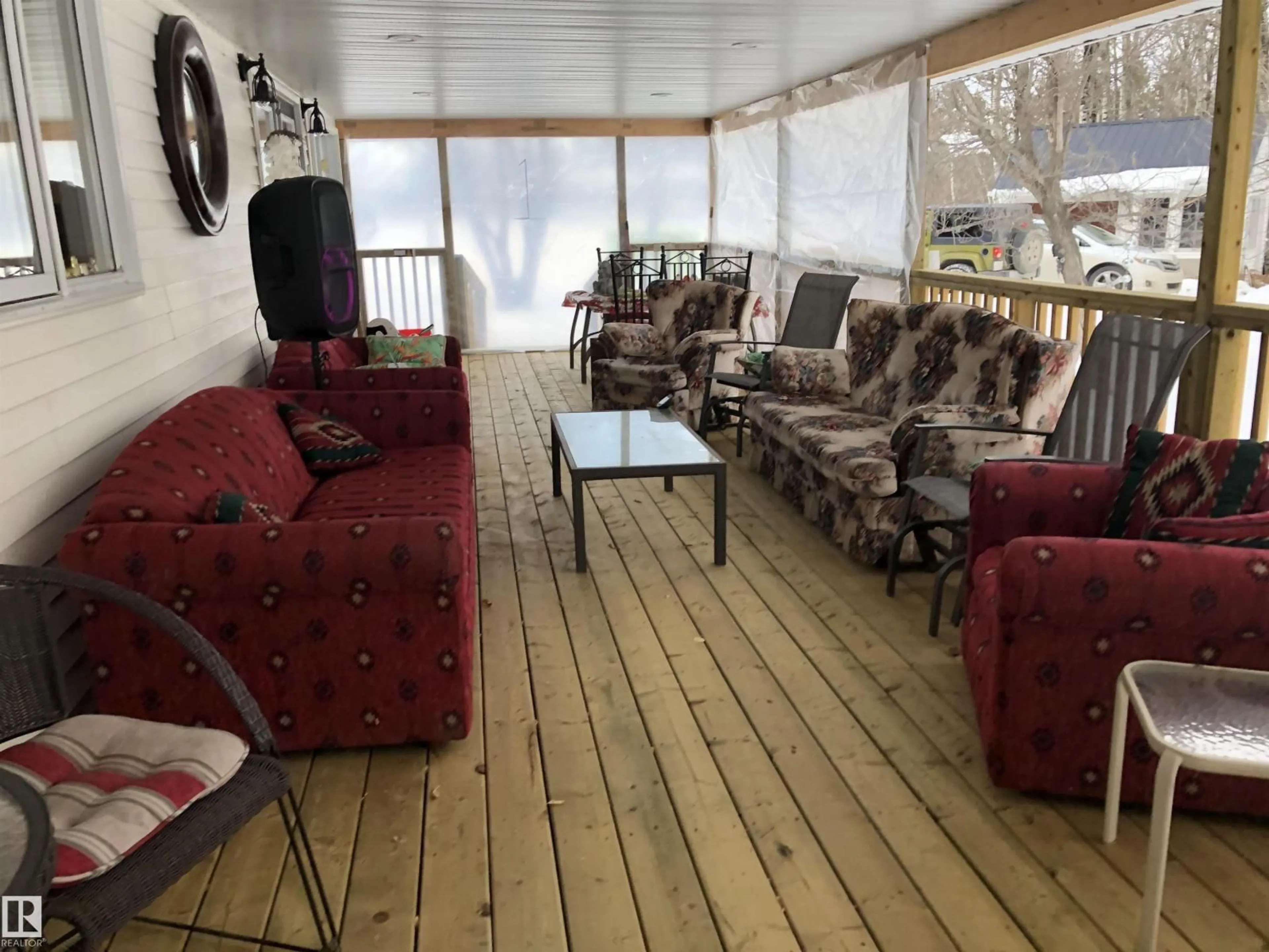 Living room with furniture, wood/laminate floor for 6211 HWY 39, Rural Brazeau County Alberta T7A1R2