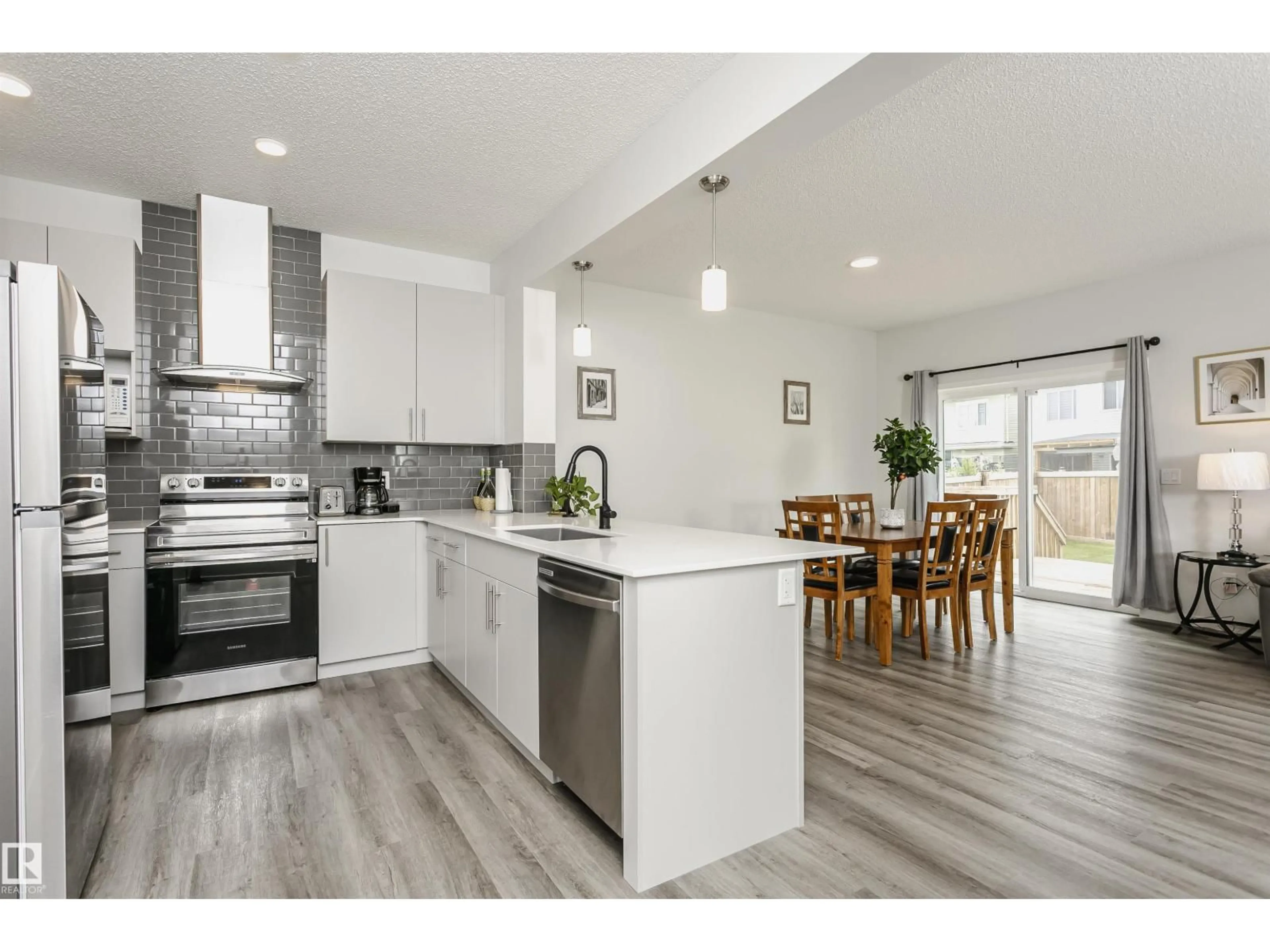 Open concept kitchen, wood/laminate floor for 1640 ERKER WY, Edmonton Alberta T6M0Z8