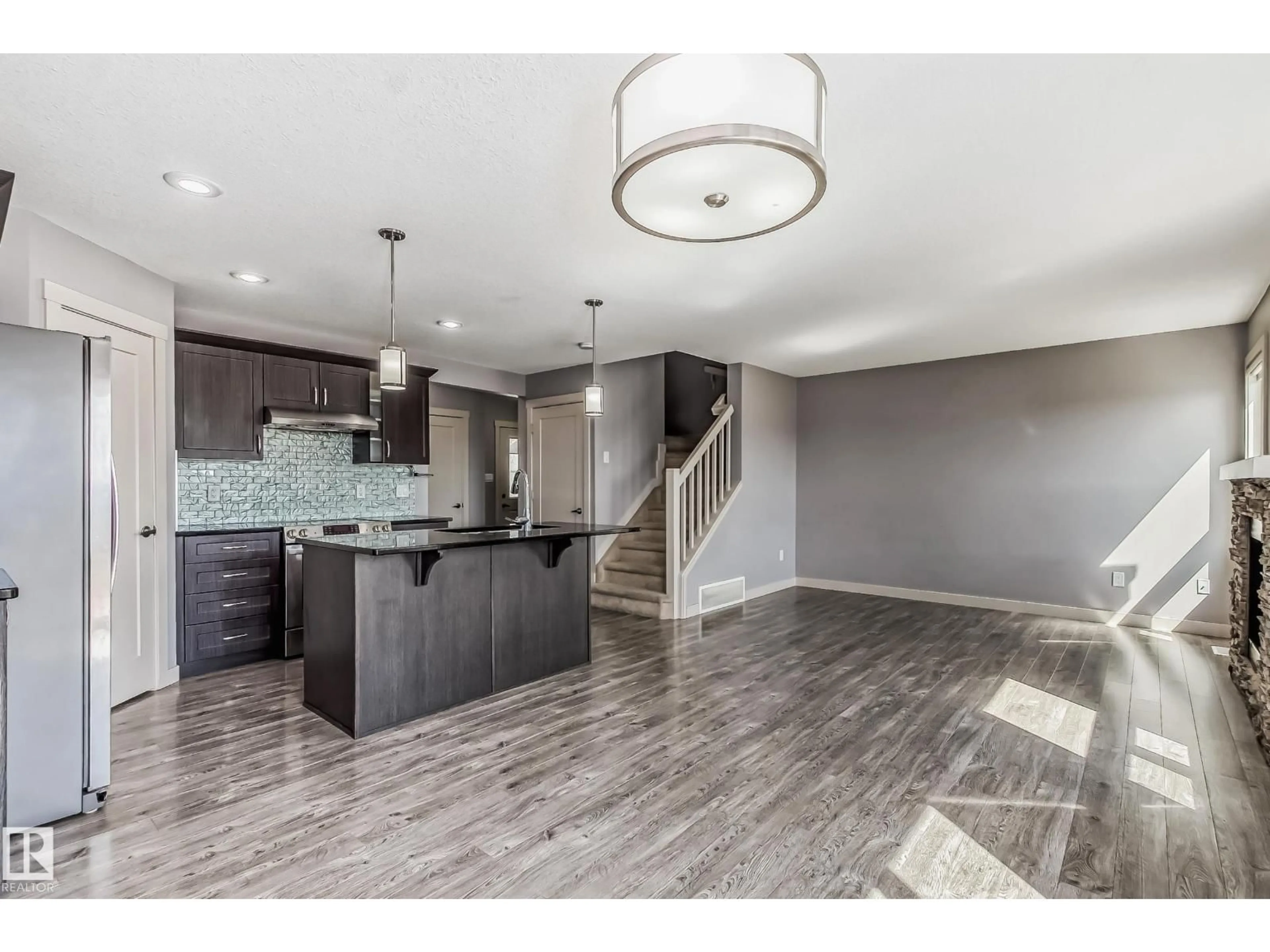 Open concept kitchen, unknown for 1669 HAMMOND CR, Edmonton Alberta T6M0N3