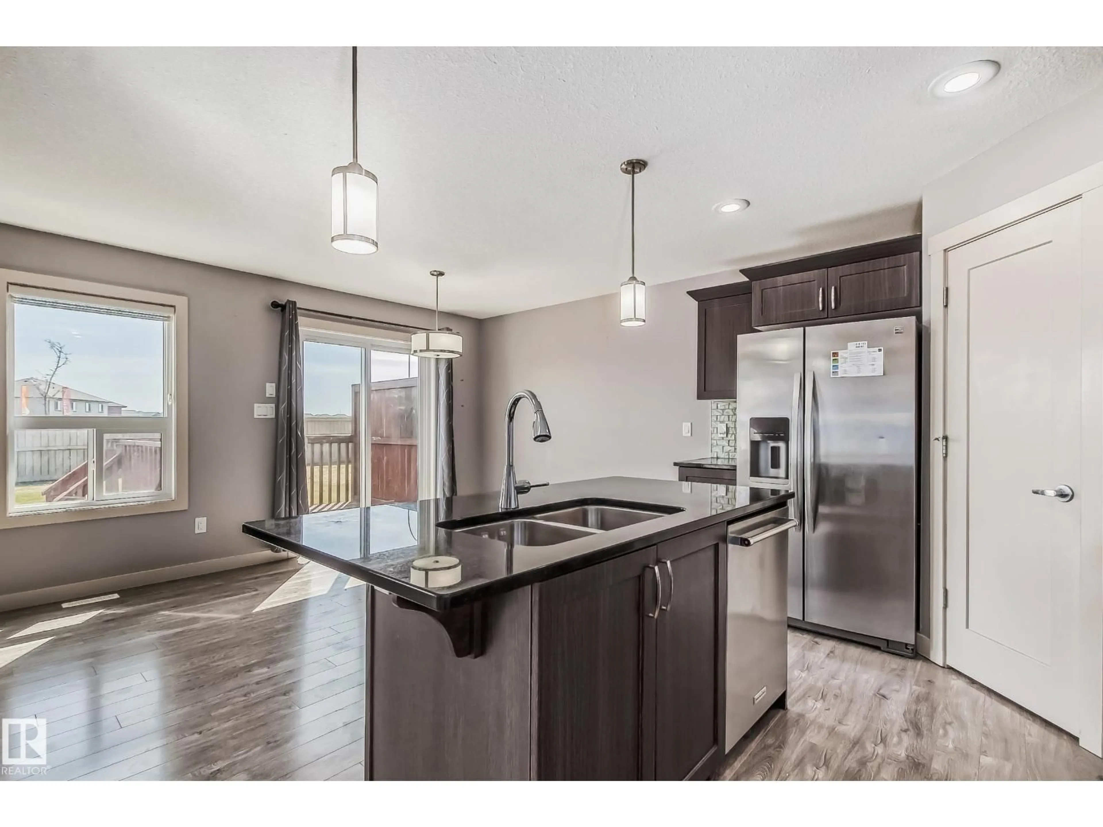 Open concept kitchen, unknown for 1669 HAMMOND CR, Edmonton Alberta T6M0N3
