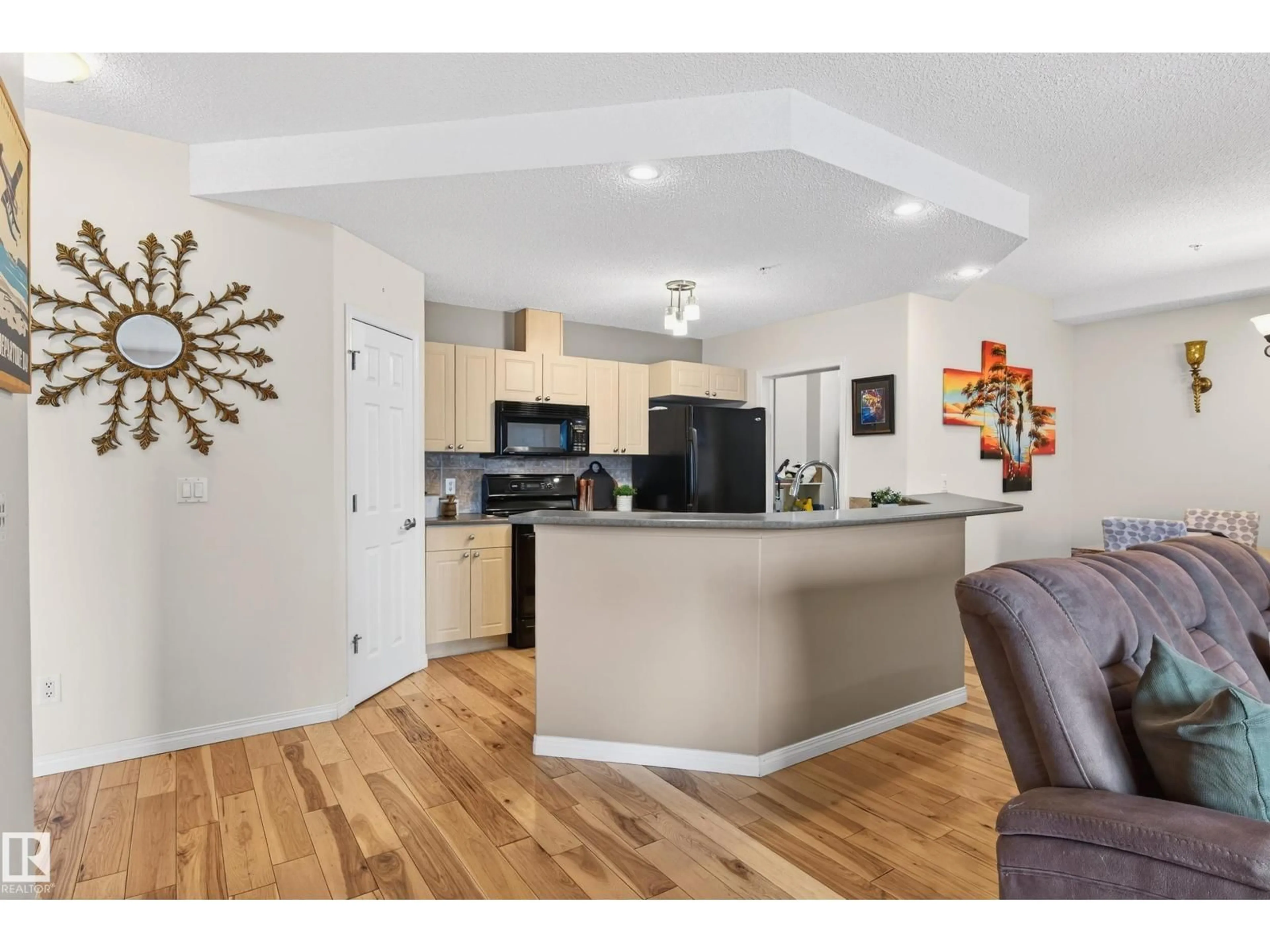Open concept kitchen, wood/laminate floor for #307 - 5280 TERWILLEGAR BV, Edmonton Alberta T6R3T9